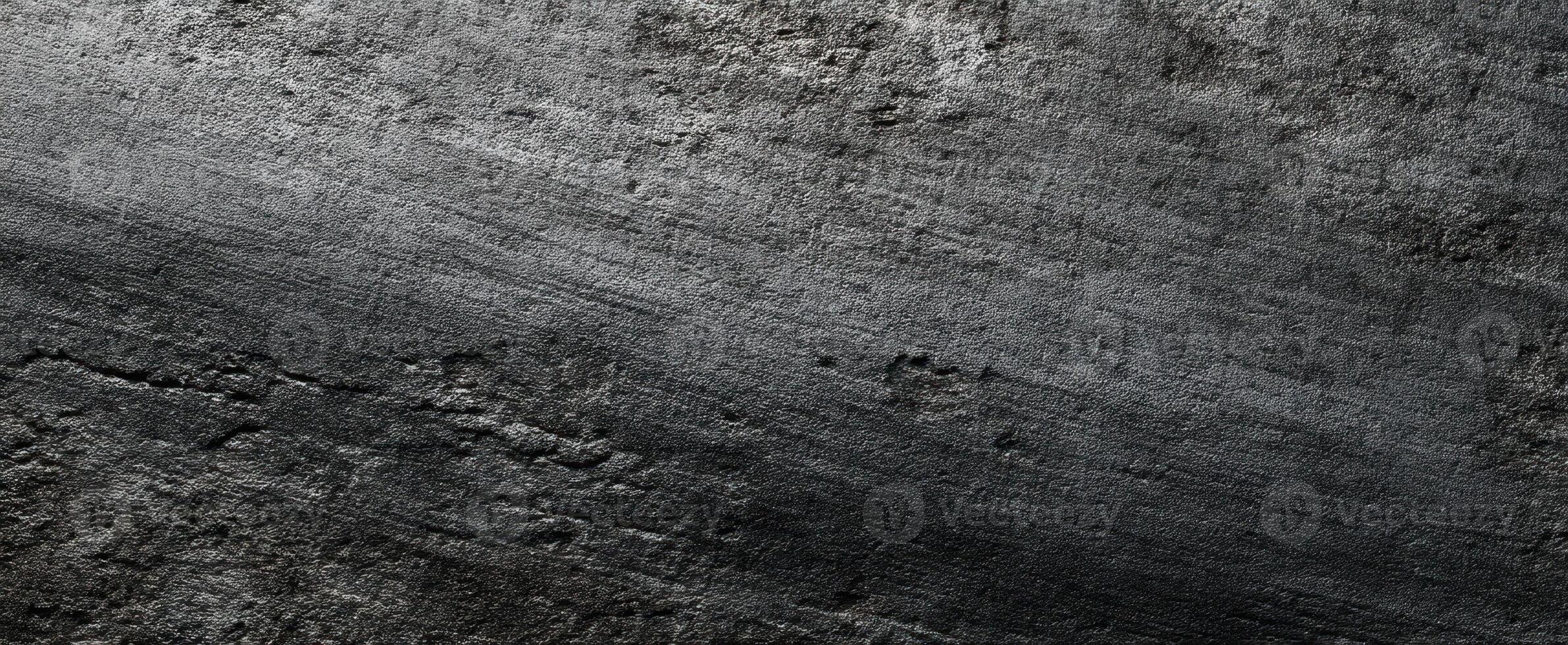 The textured surface of dark metallic background with subtle lines and imperfections. photo