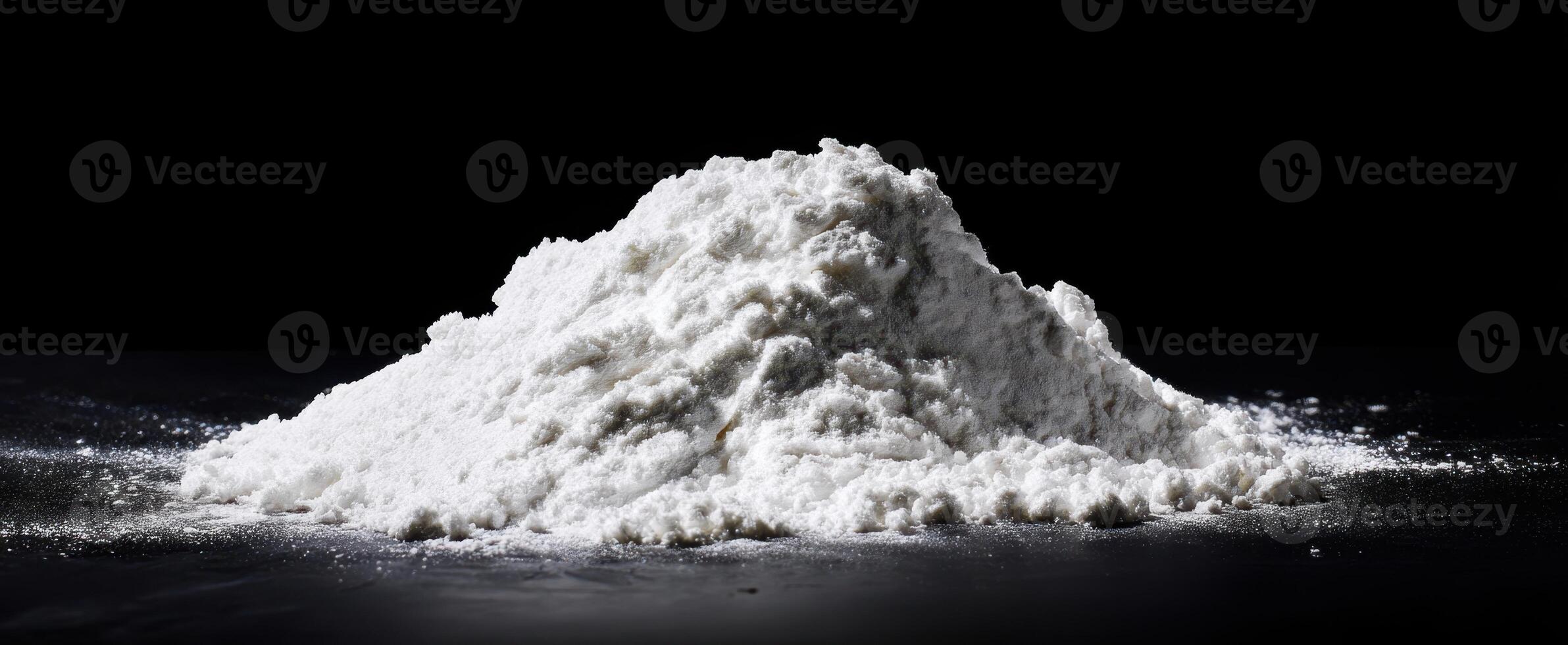 The mound of white flour ready for culinary creations and baking mastery. photo