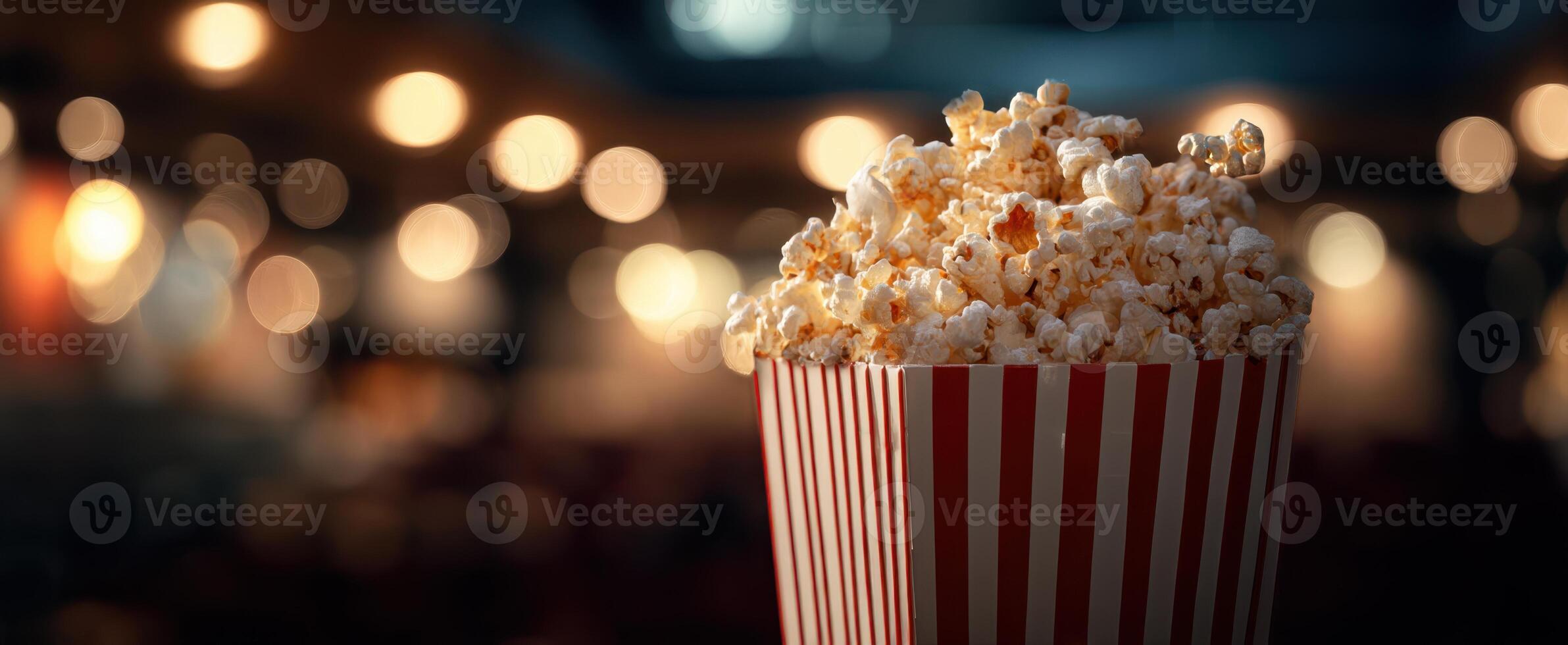 The vibrant bucket of popcorn against a soft blurry background. photo