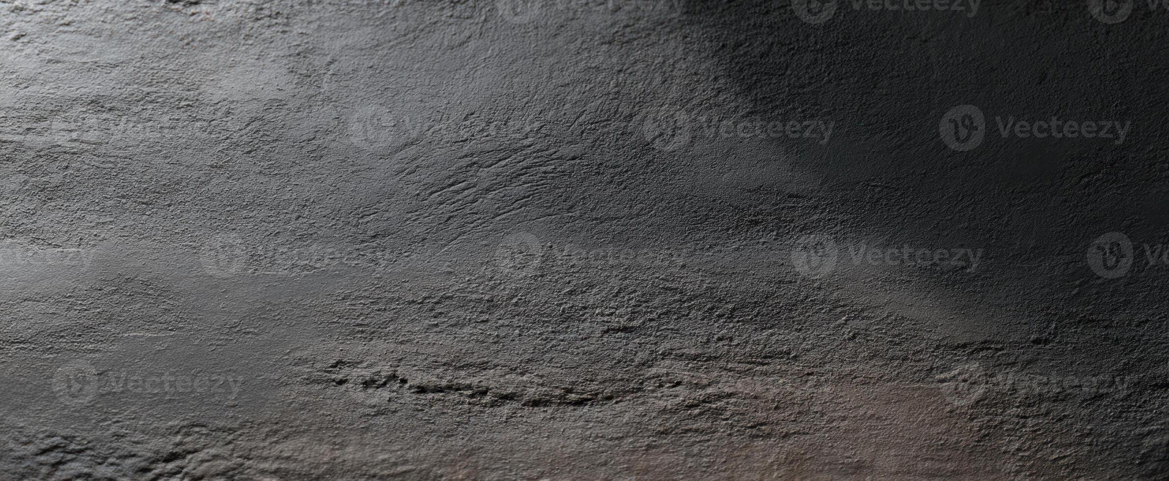 The textured gray surface with subtle shadows and intricate patterns. photo