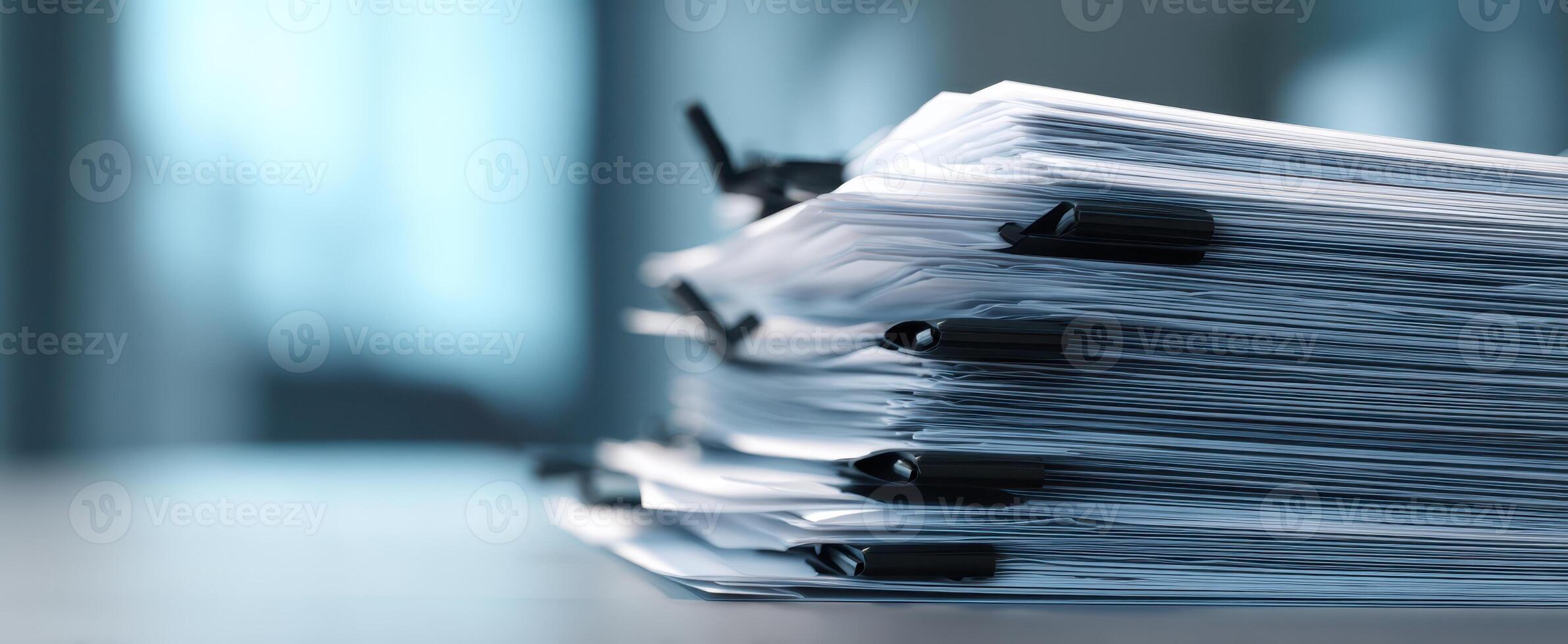 The stack of organized documents in a modern office environment. photo