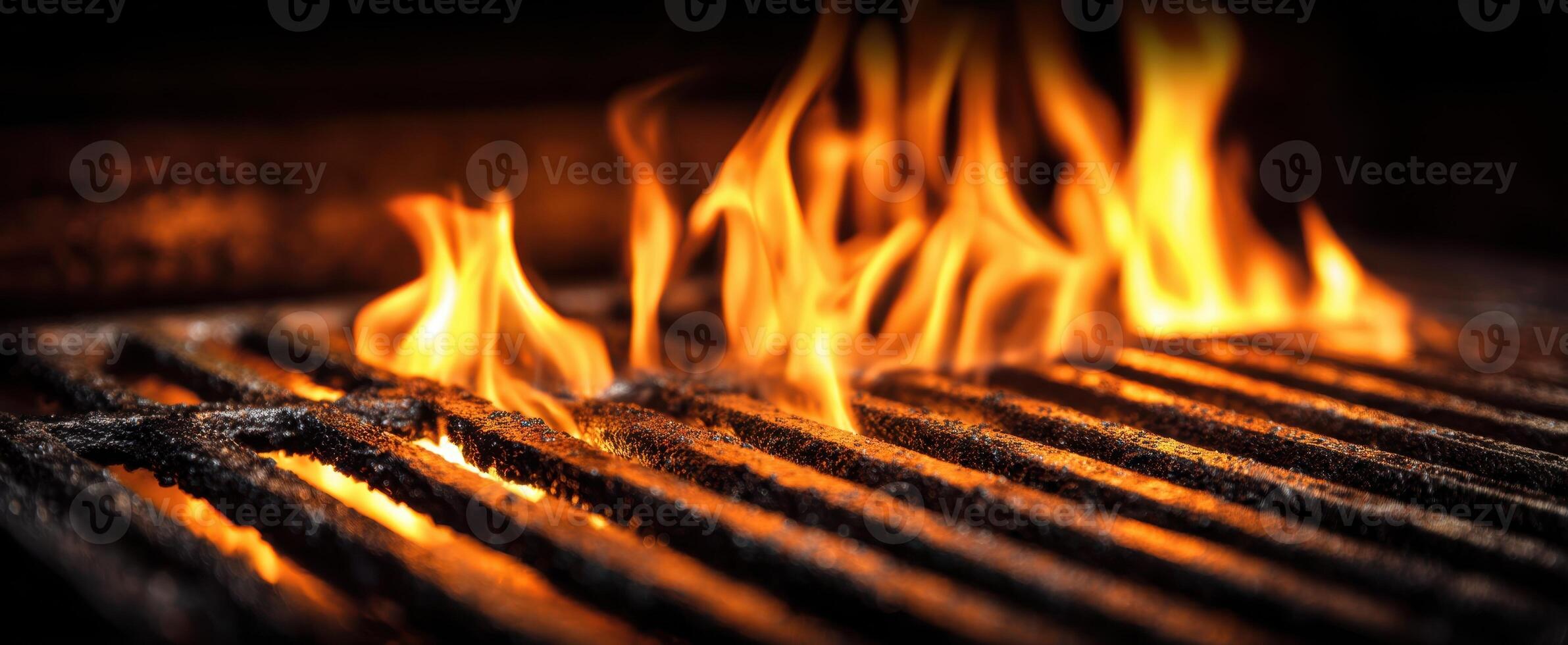 The vibrant flames dancing over a charcoal grill in a backyard setting. photo