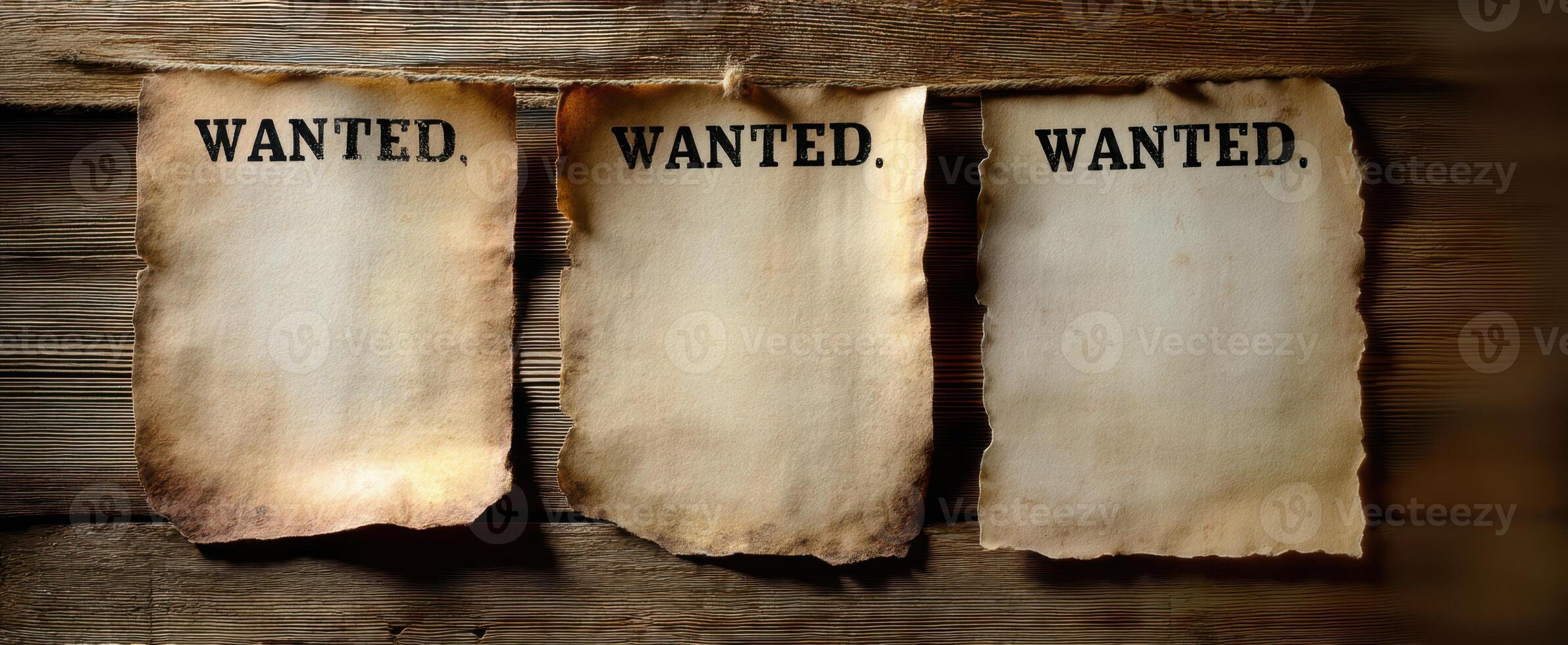 The wanted posters hanging against a rustic wooden background. photo