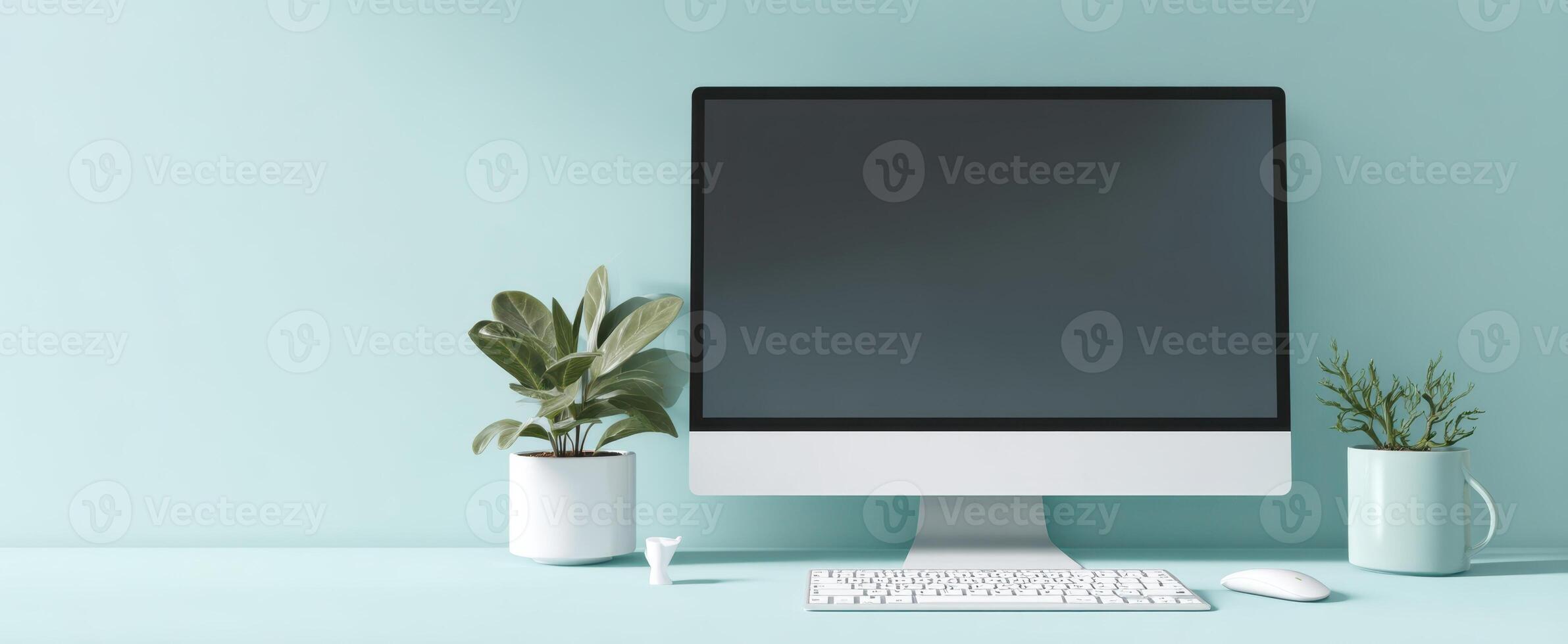 The modern computer setup with plants for a stylish workspace. photo
