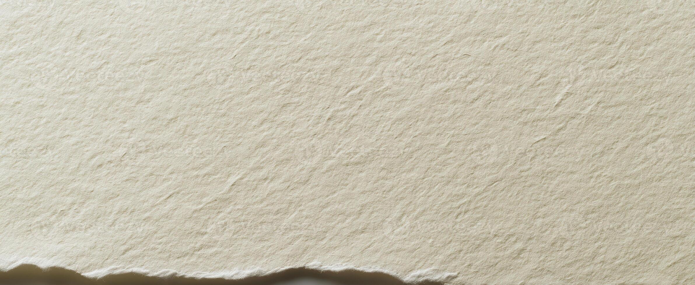 The textured surface of handmade paper with a rough edge for design inspiration. photo