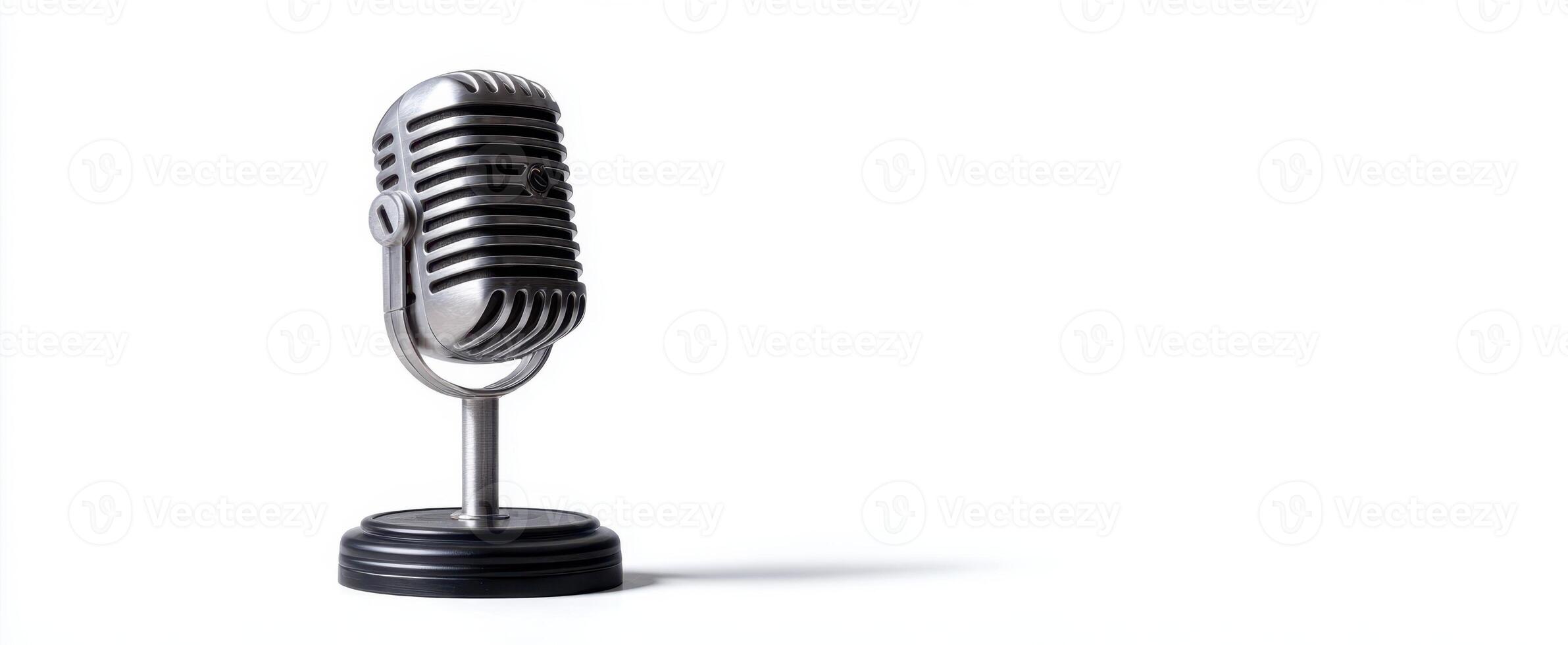 The vintage microphone on a stand against a plain background photo