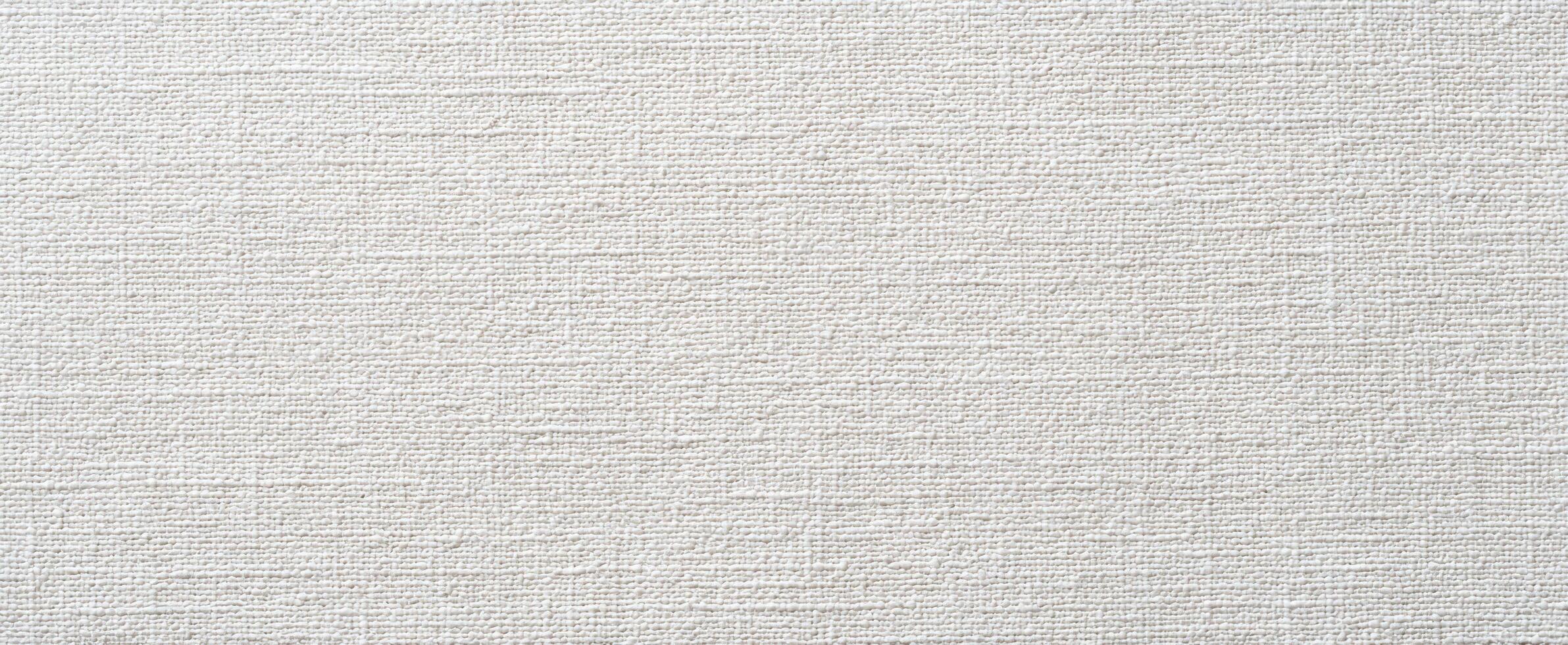 The elegant textured fabric surface in soft white tones for design applications photo