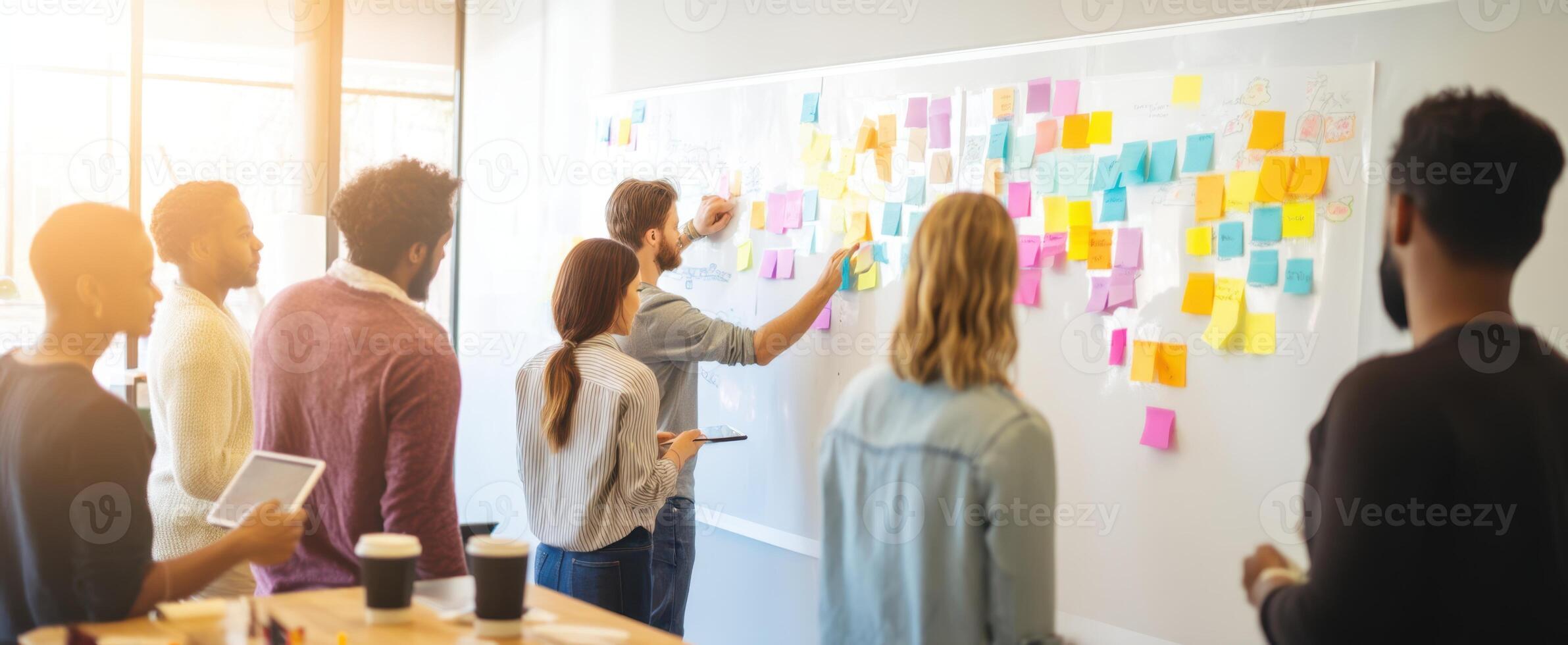 The team collaborating on creative ideas with colorful sticky notes. photo