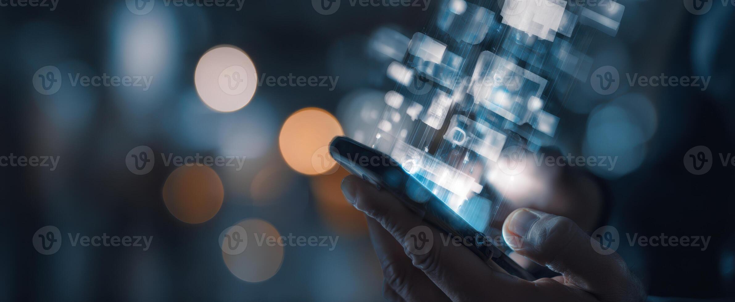 The smartphone displaying a futuristic digital interface in a dark environment. photo