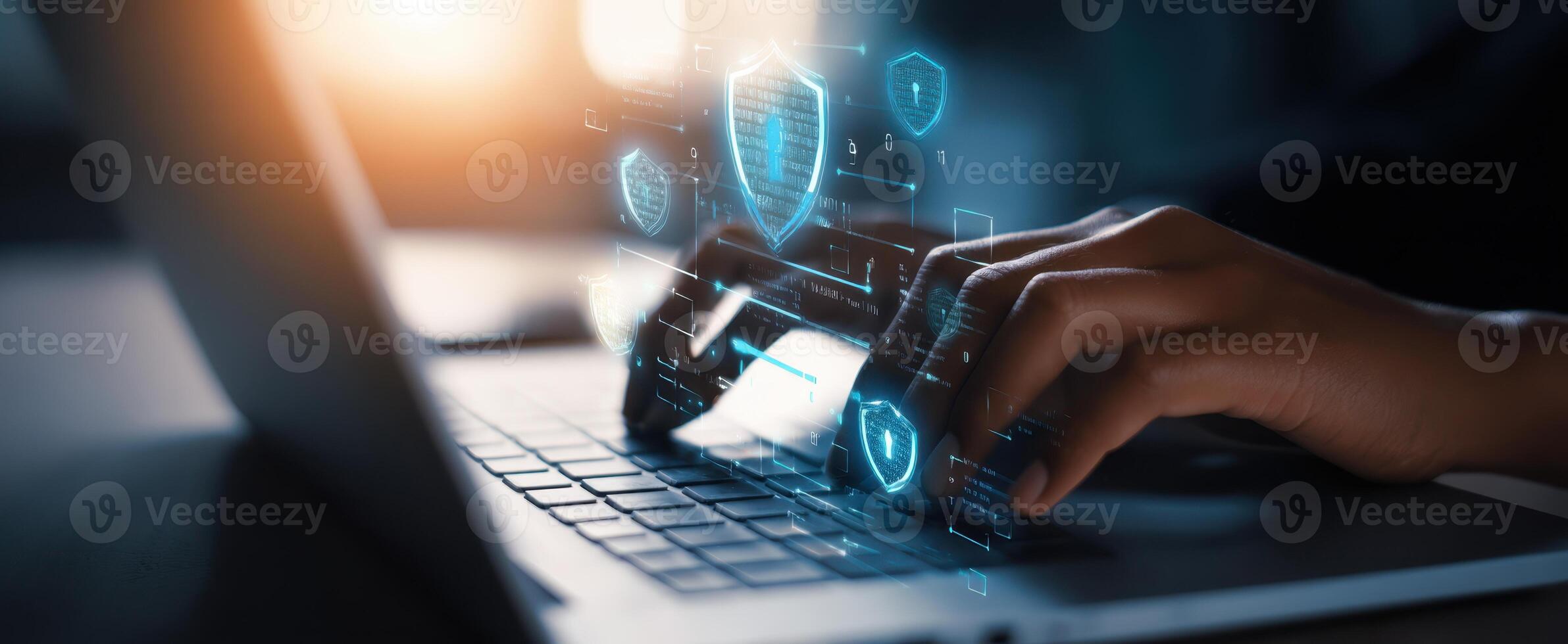 The hands typing on a laptop with digital security icons representing protection. photo