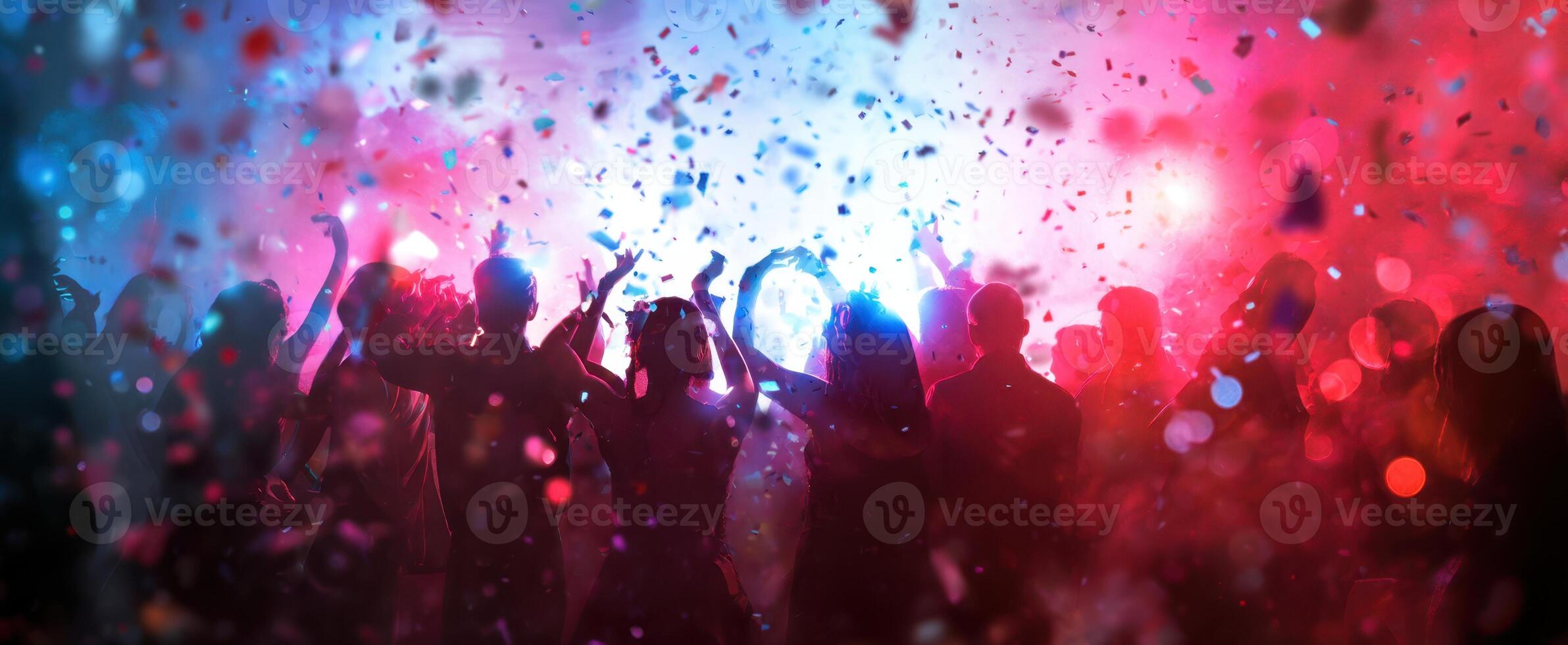 The vibrant celebration with dancing silhouettes and colorful confetti in the air. photo