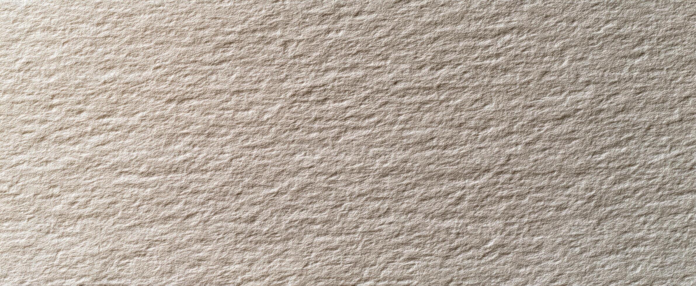 The subtle texture of beige handmade paper surface for creative backgrounds photo