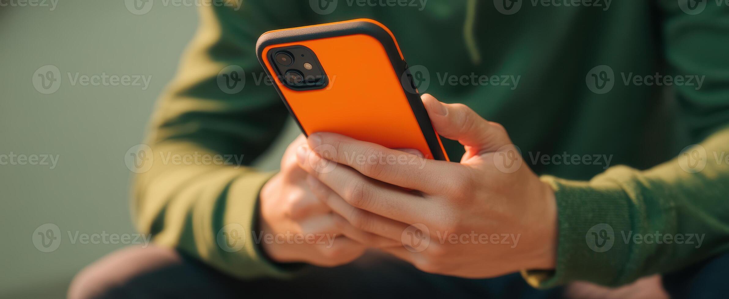 The vibrant smartphone in hands of a person engaged in casual use. photo