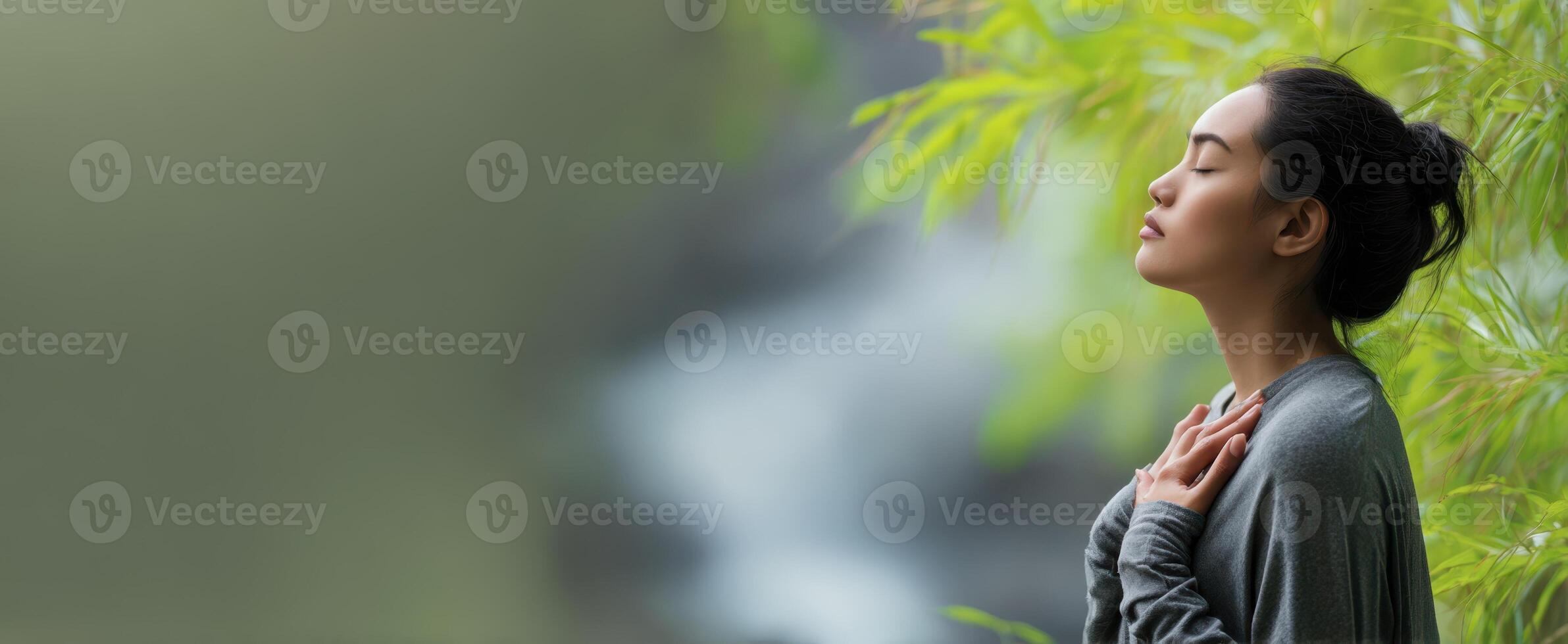 The woman finding peace in nature through mindfulness and meditation. photo