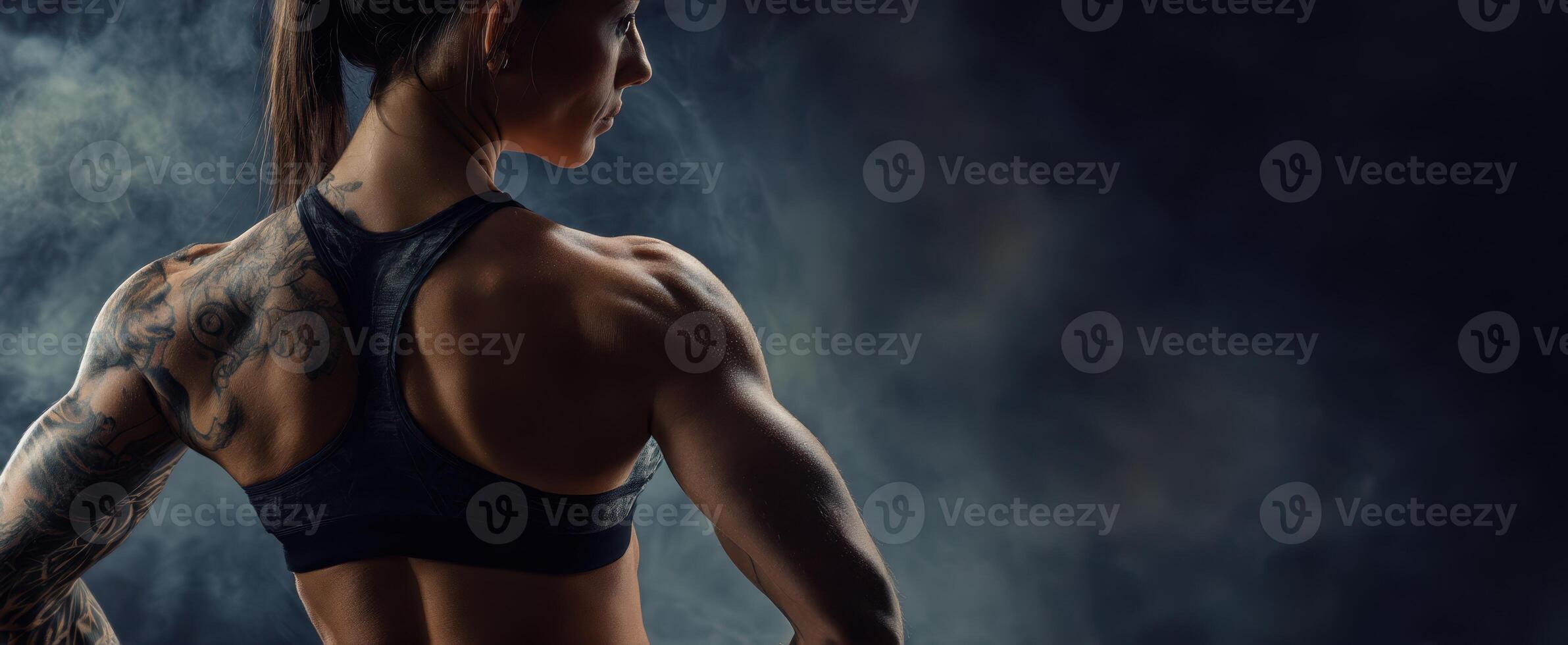 The powerful athlete showcasing strength and determination in a dramatic setting. photo