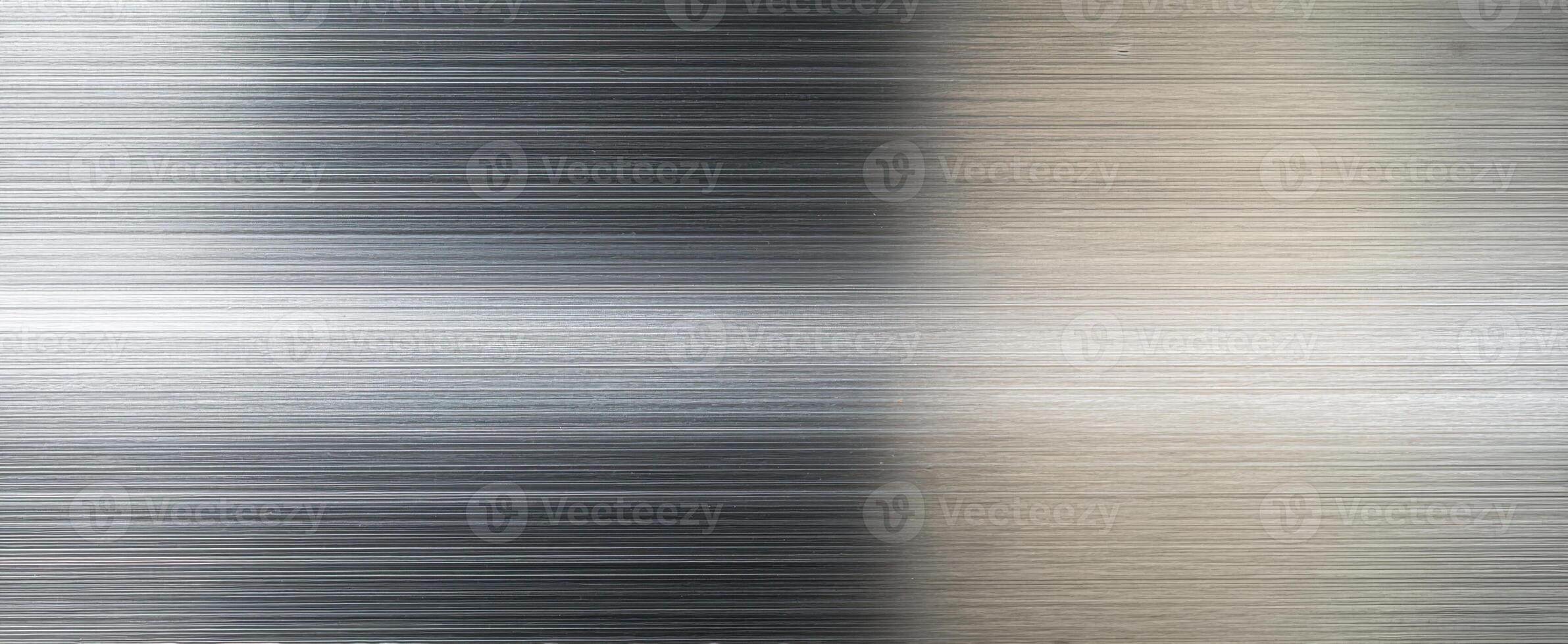 The sleek brushed metal surface with elegant reflective qualities. photo