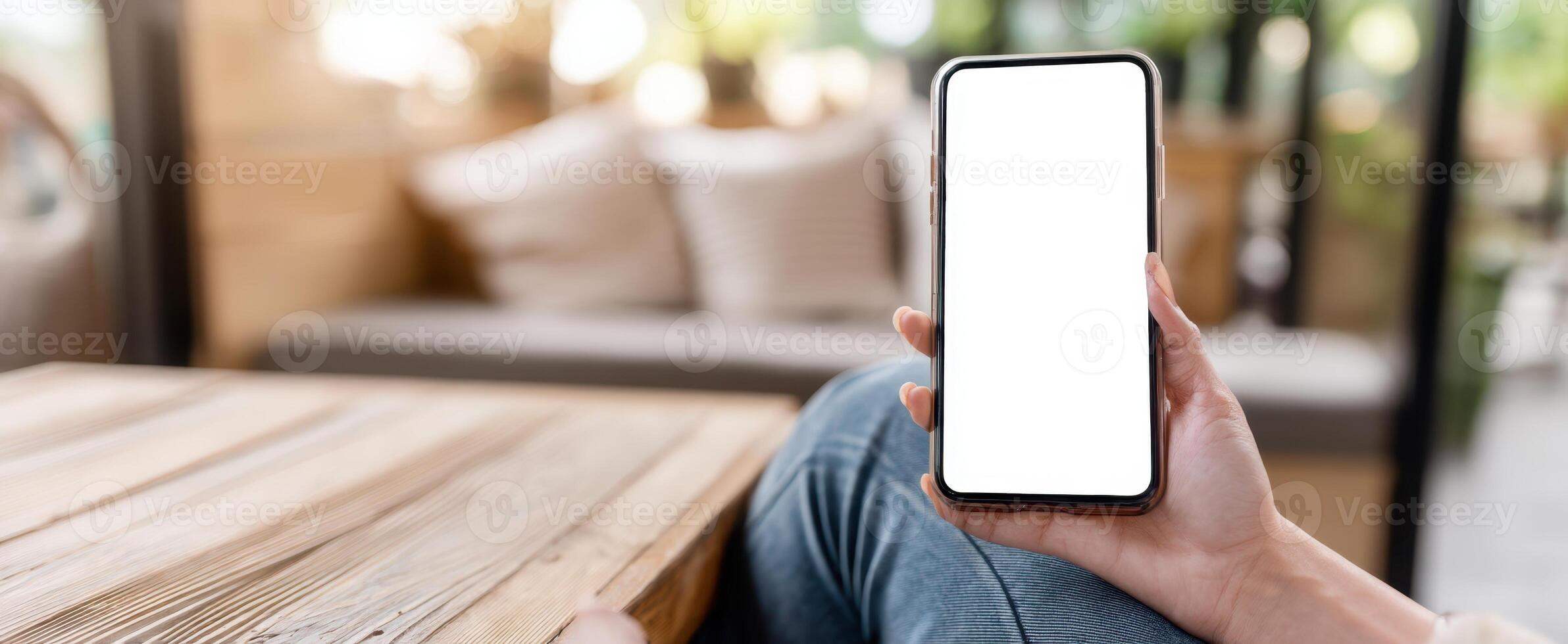 The smartphone held in a hand ready for digital mockup display. photo