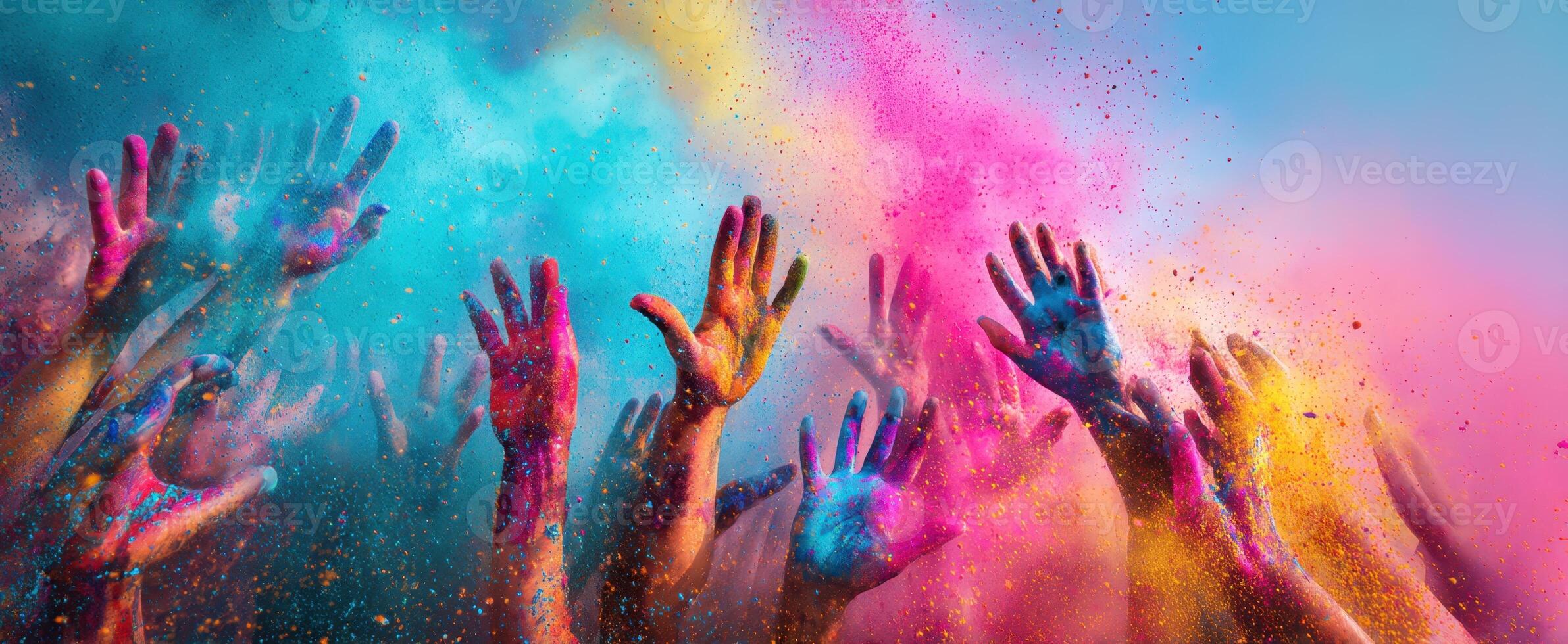 The Colorful Celebration of Hands in Vibrant Powder during a Joyful Festival photo