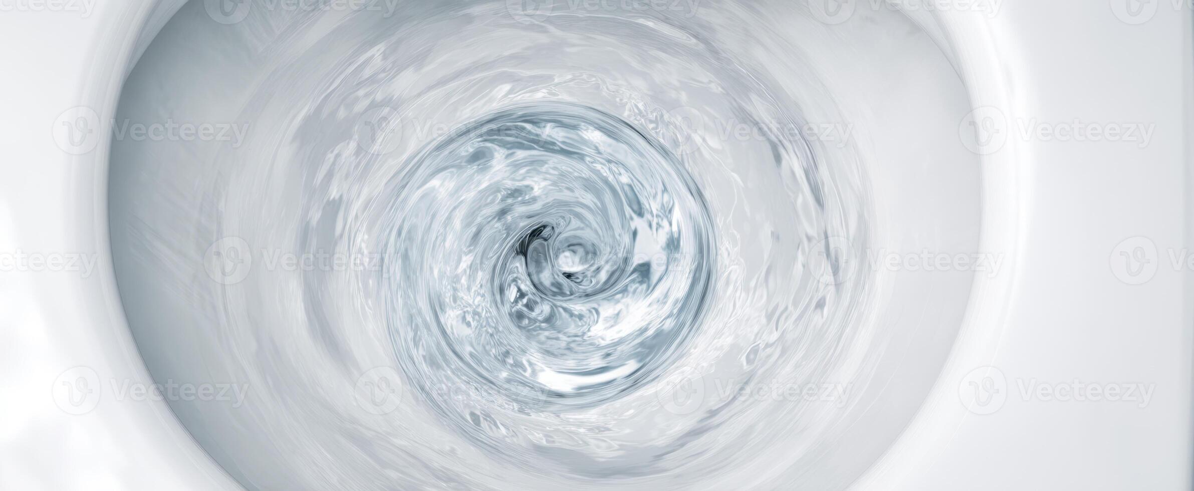 The swirling water inside a modern toilet bowl creating dynamic motion photo