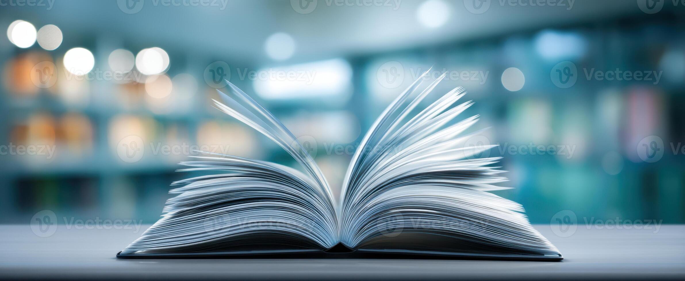 The open book with fluttering pages in a cozy library setting photo