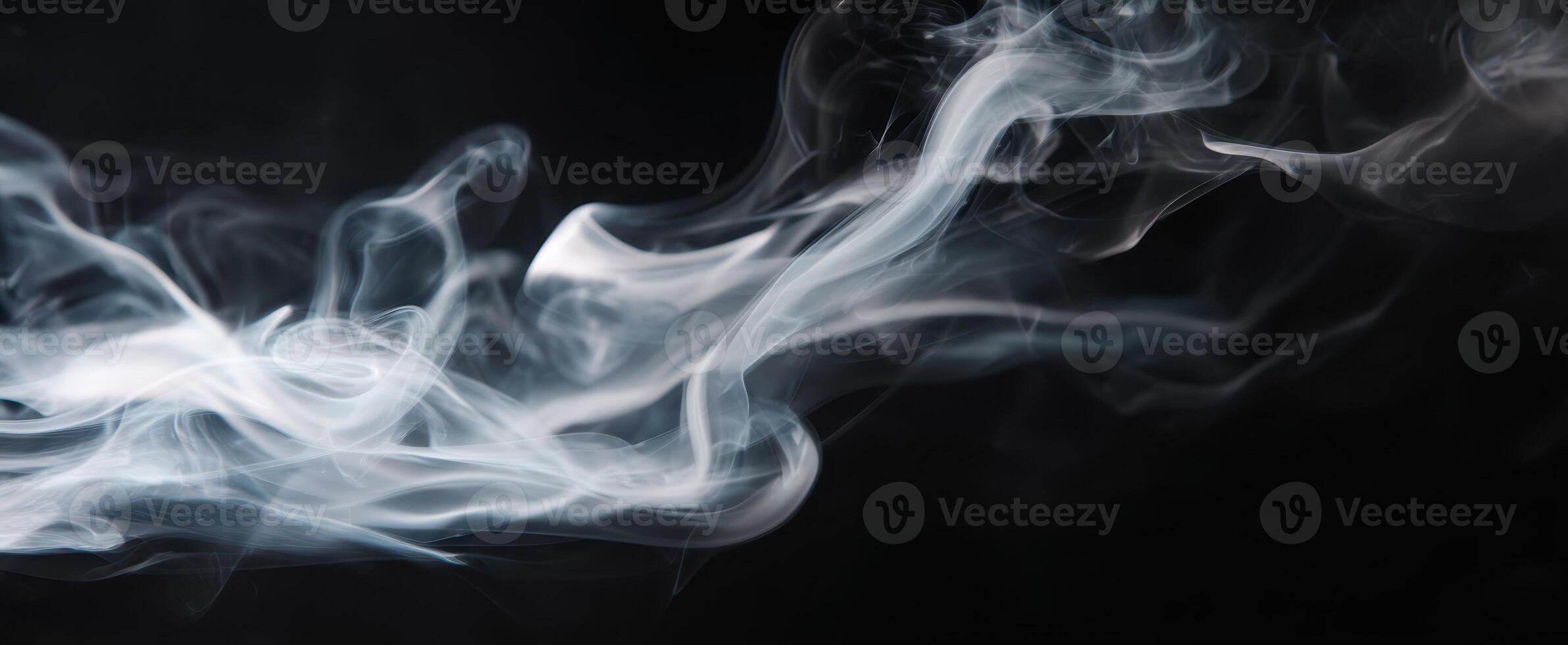 The Captivating Dance of Smoke Against a Dark Background photo