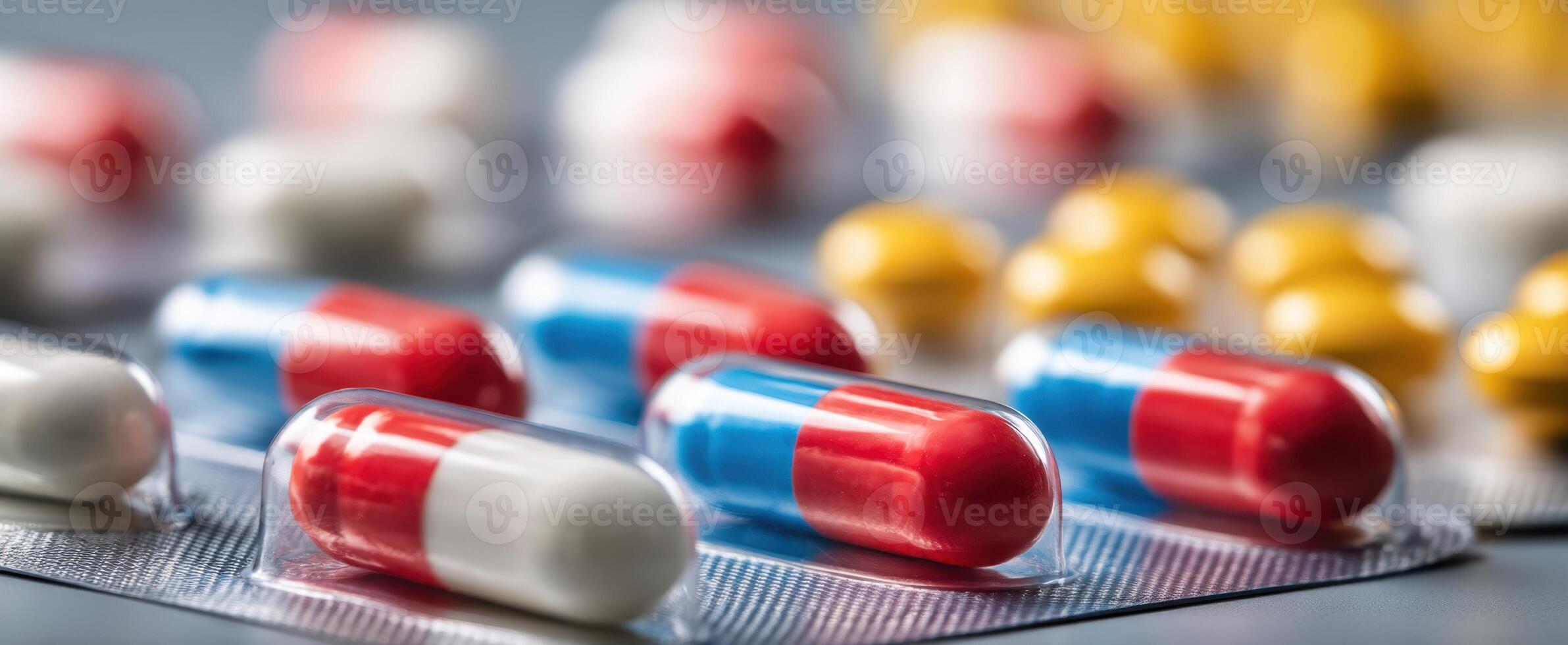 The vibrant capsules arranged on a table for healthcare and medicinal purposes. photo