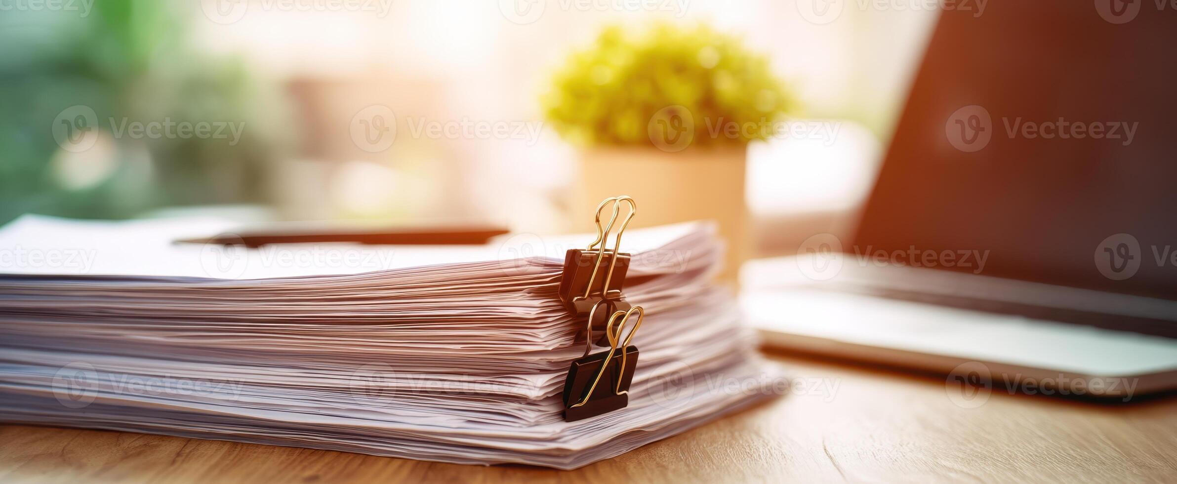 The accumulation of important documents on a stylish office desk photo