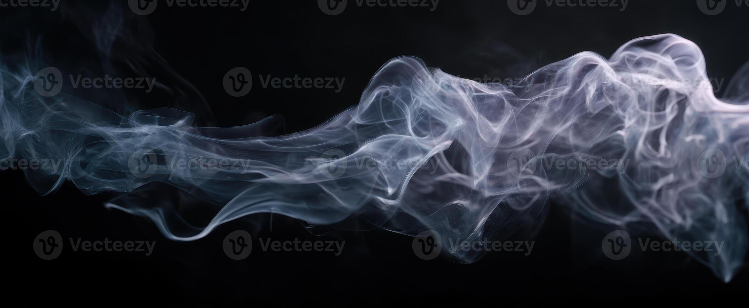The delicate beauty of swirling smoke against a dark backdrop. photo