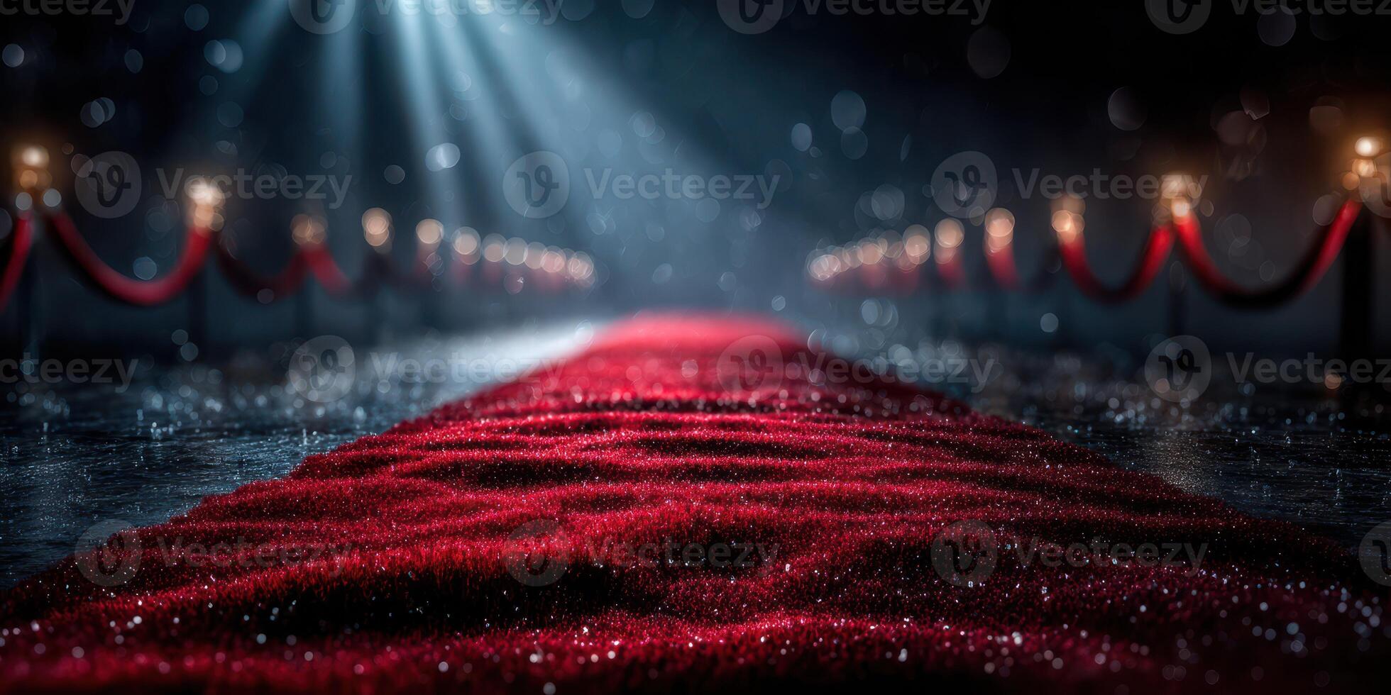 Red carpet leading to an elegant event venue illuminated by soft lights and surrounded by glamorous decoration photo