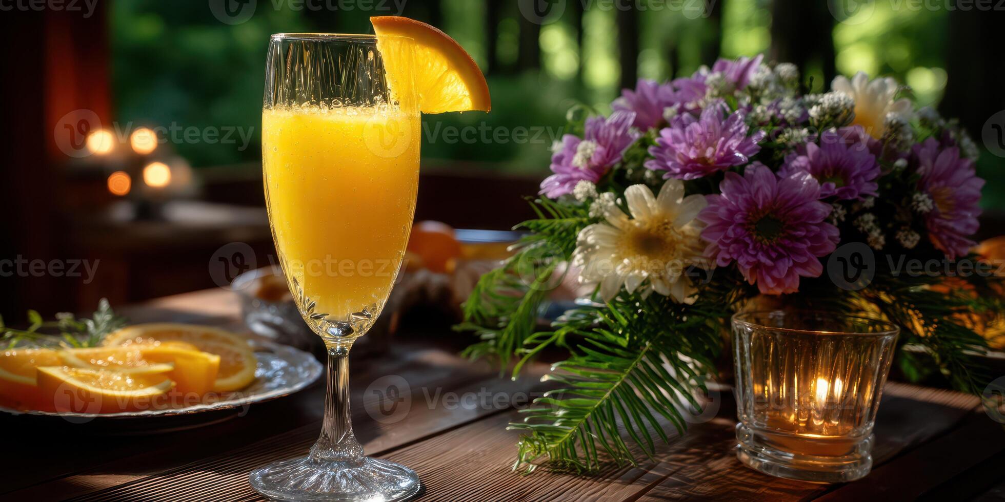 Refreshing citrus drink served in a tall glass beside a vibrant flower arrangement during a sunny afternoon gathering photo