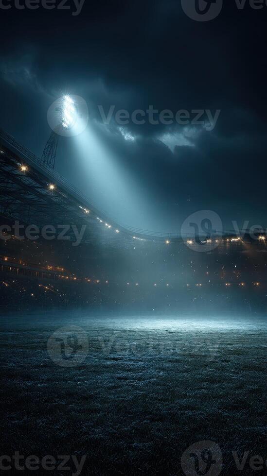 Nighttime stadium illuminated by floodlights with an empty field awaiting a match photo