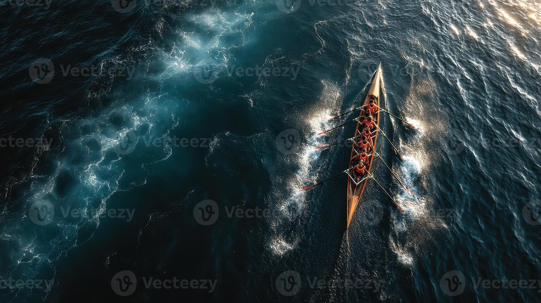 Rowers navigate through calm waters in a synchronized team effort during early morning light photo