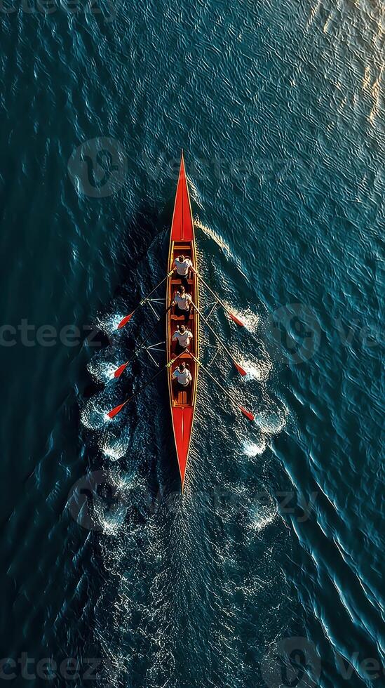 Rowers practice their skills on a tranquil lake in the early morning light with a vivid sky as backdrop photo