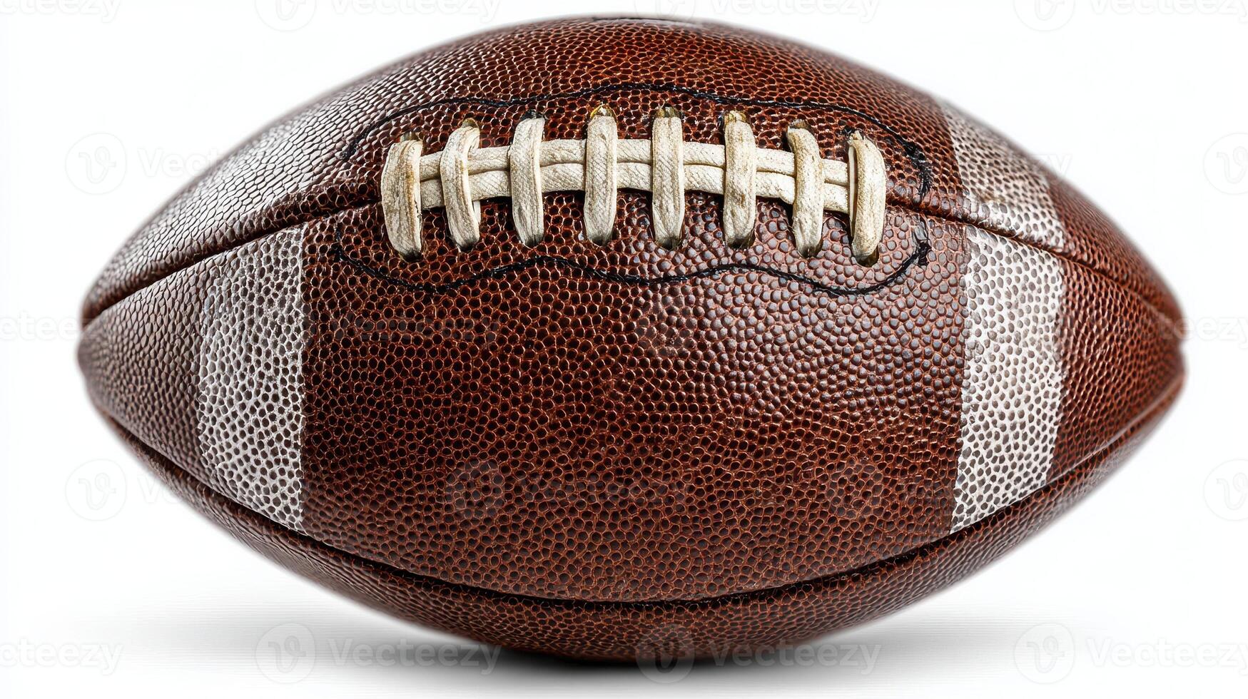 Brown leather football resting on a smooth surface with white stripes and laces for a sports-themed display photo