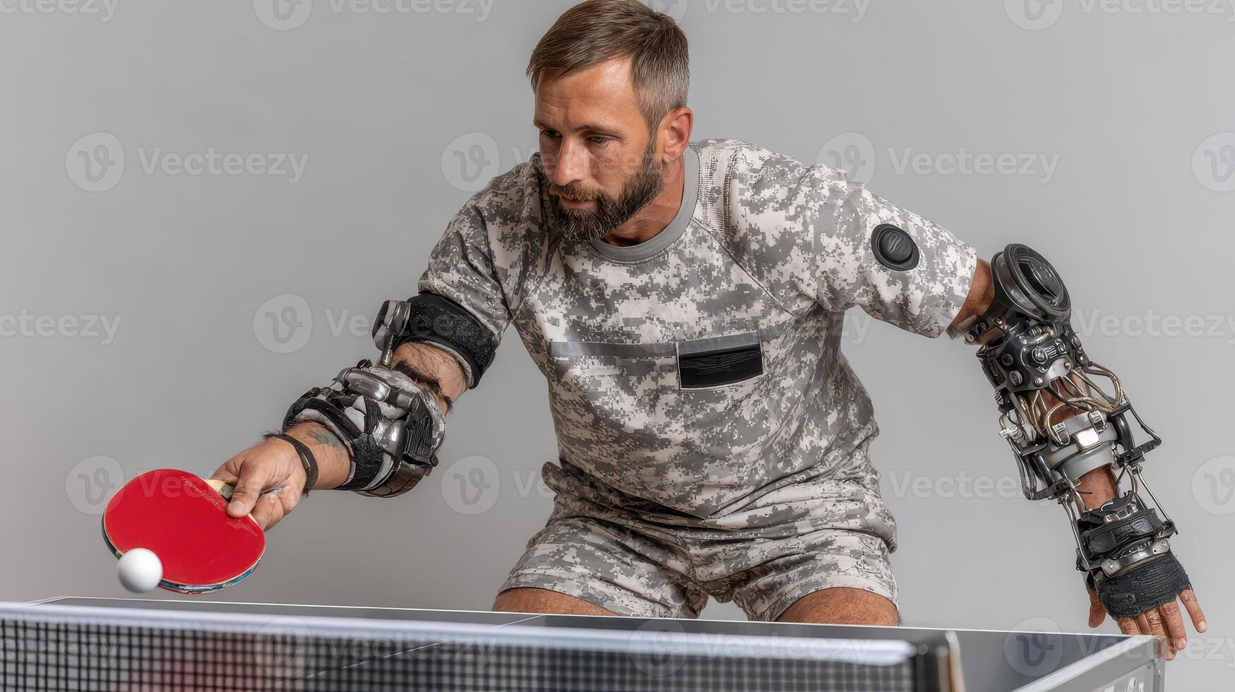 Innovative technology enables a veteran to play table tennis with robotic arms in a training session photo