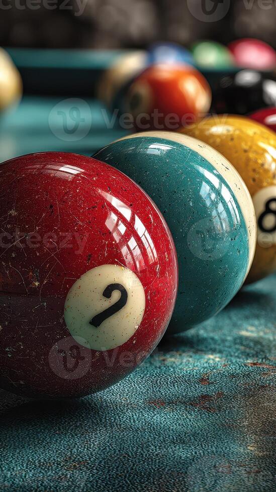 Colorful billiard balls arranged on a textured green felt table in a game setting photo