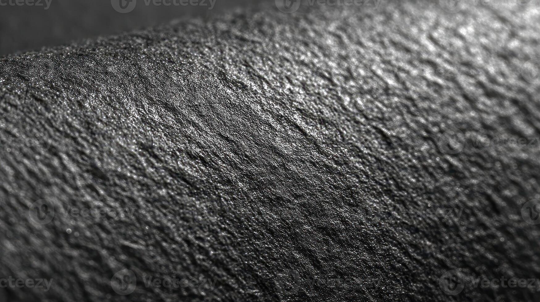 Surface texture of a rough material in black and white showcasing intricate details and patterns photo