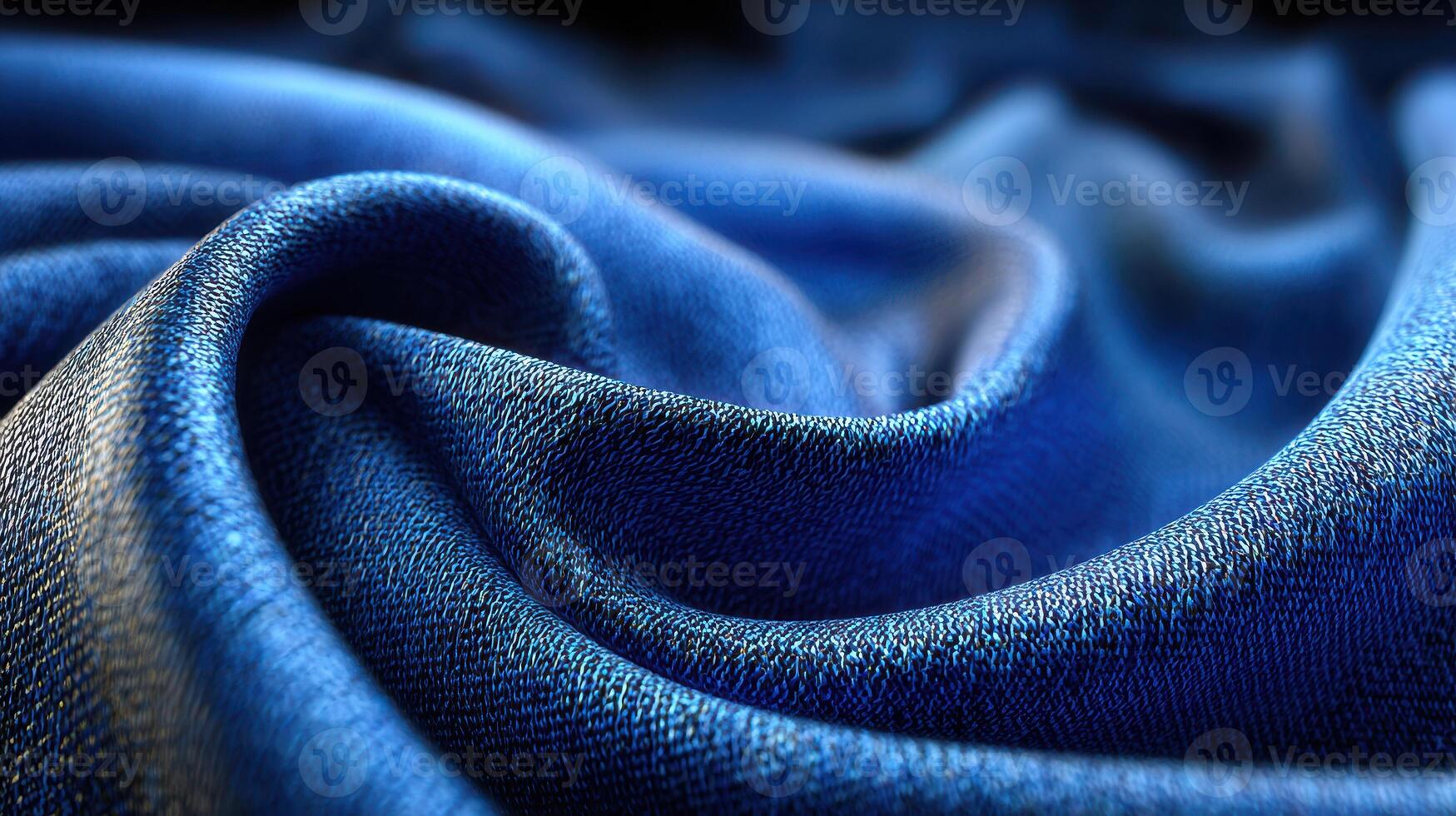 Beautiful deep blue fabric with rich texture and gentle folds showcasing elegance and luxury in soft lighting photo