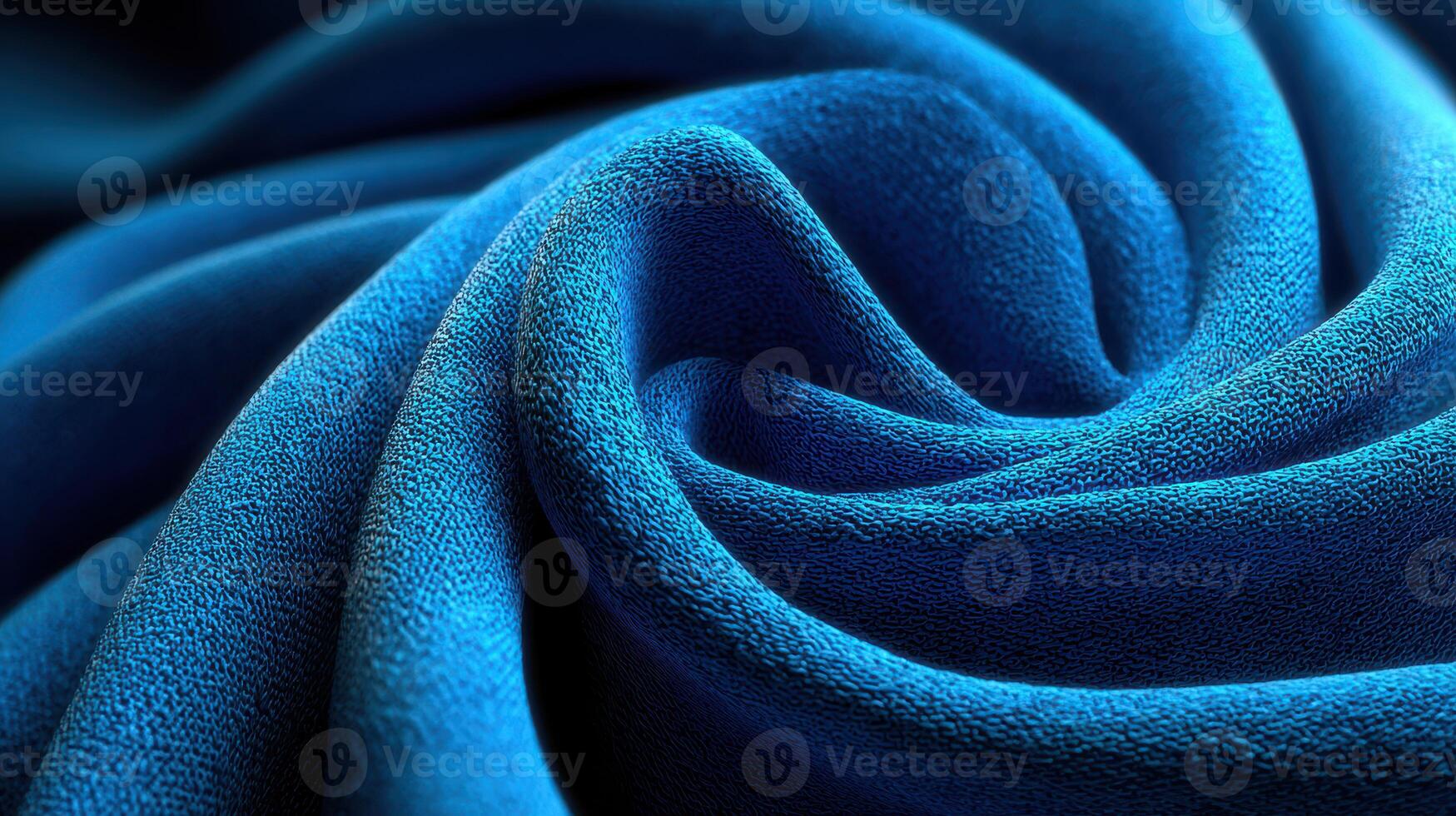 Soft blue fabric swirls elegantly, showcasing texture and depth under natural lighting conditions photo