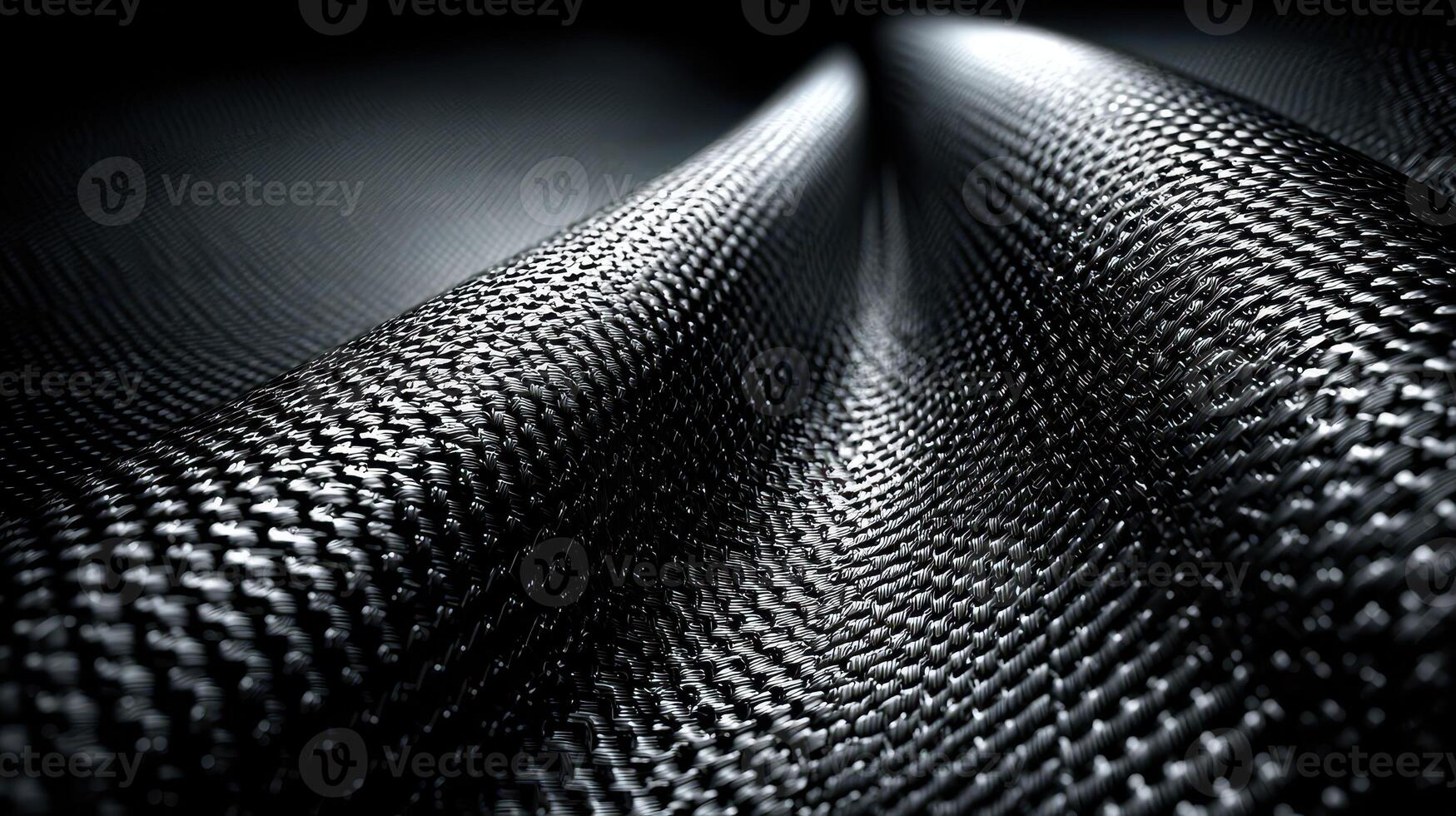 Textured black fabric displays intricate patterns and depth under soft lighting, showcasing craftsmanship and design photo