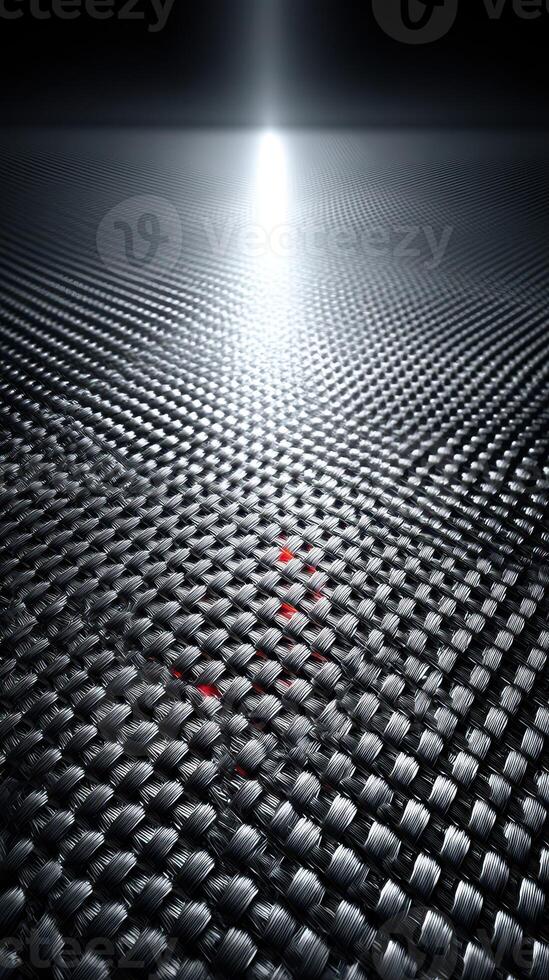 Reflective textured surface with a bright light source illuminating a dark environment at an abstract angle photo