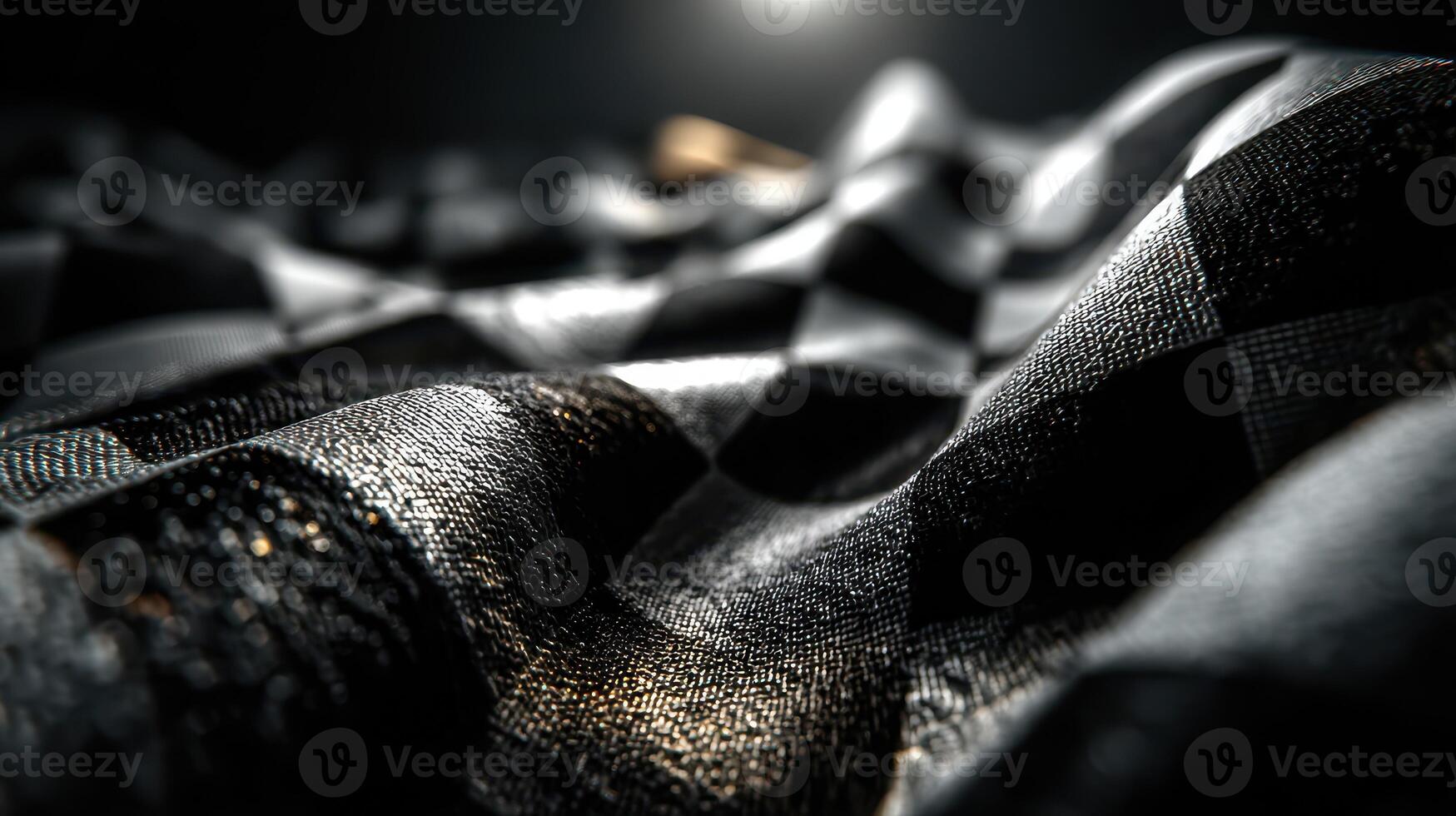 Detailed close-up of textured black and gold checkered fabric in soft light showcasing intricate patterns and colors photo