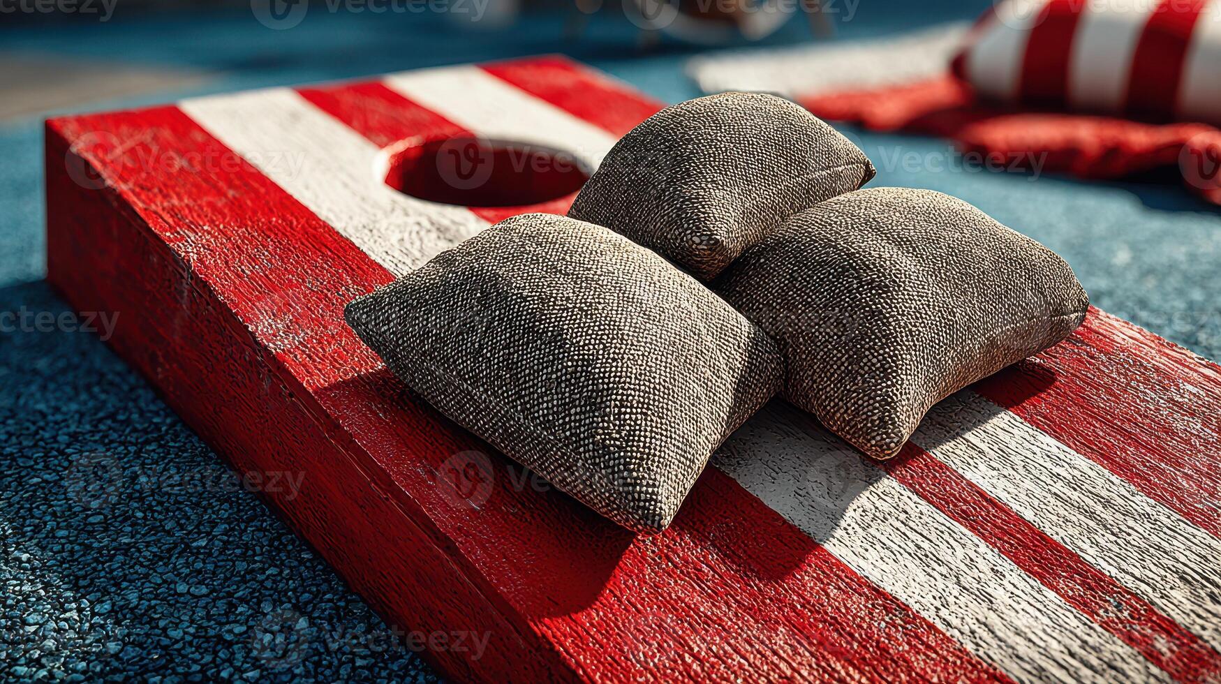 Playing bean bag toss on a sunny day in the park with colorful equipment and fun designs photo
