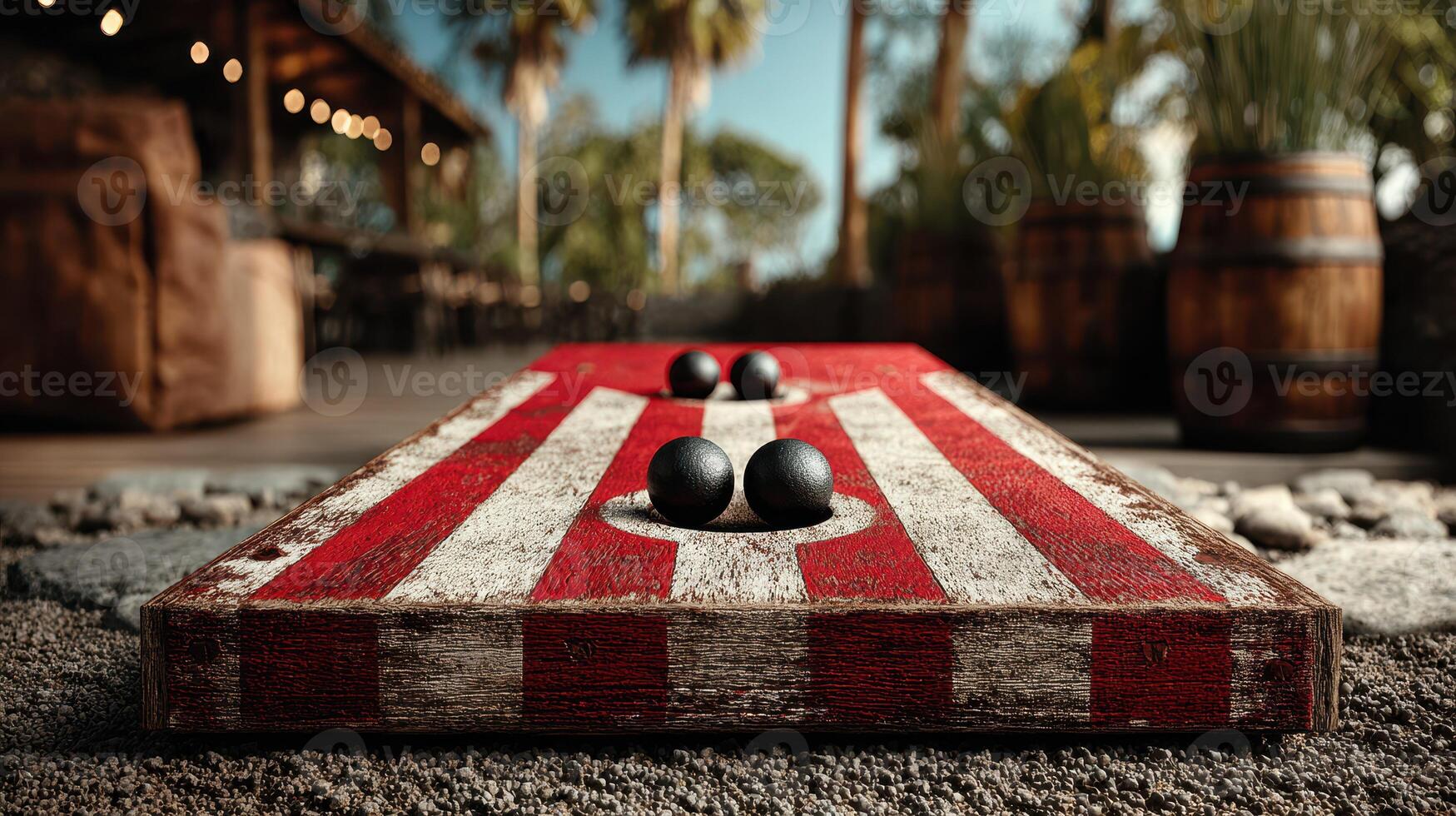 Players enjoy a lively outdoor game of boules on a warm day near a rustic bar and palm trees photo