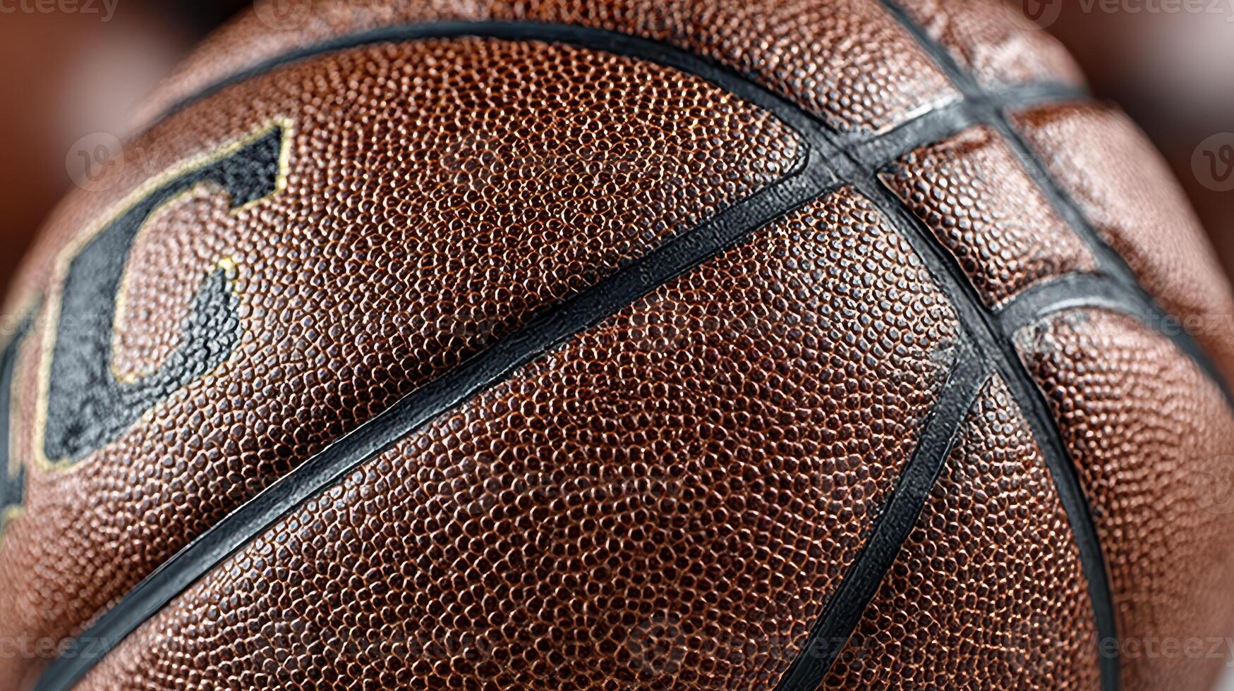 Close-up view of a worn basketball showcasing texture and detail in natural lighting photo