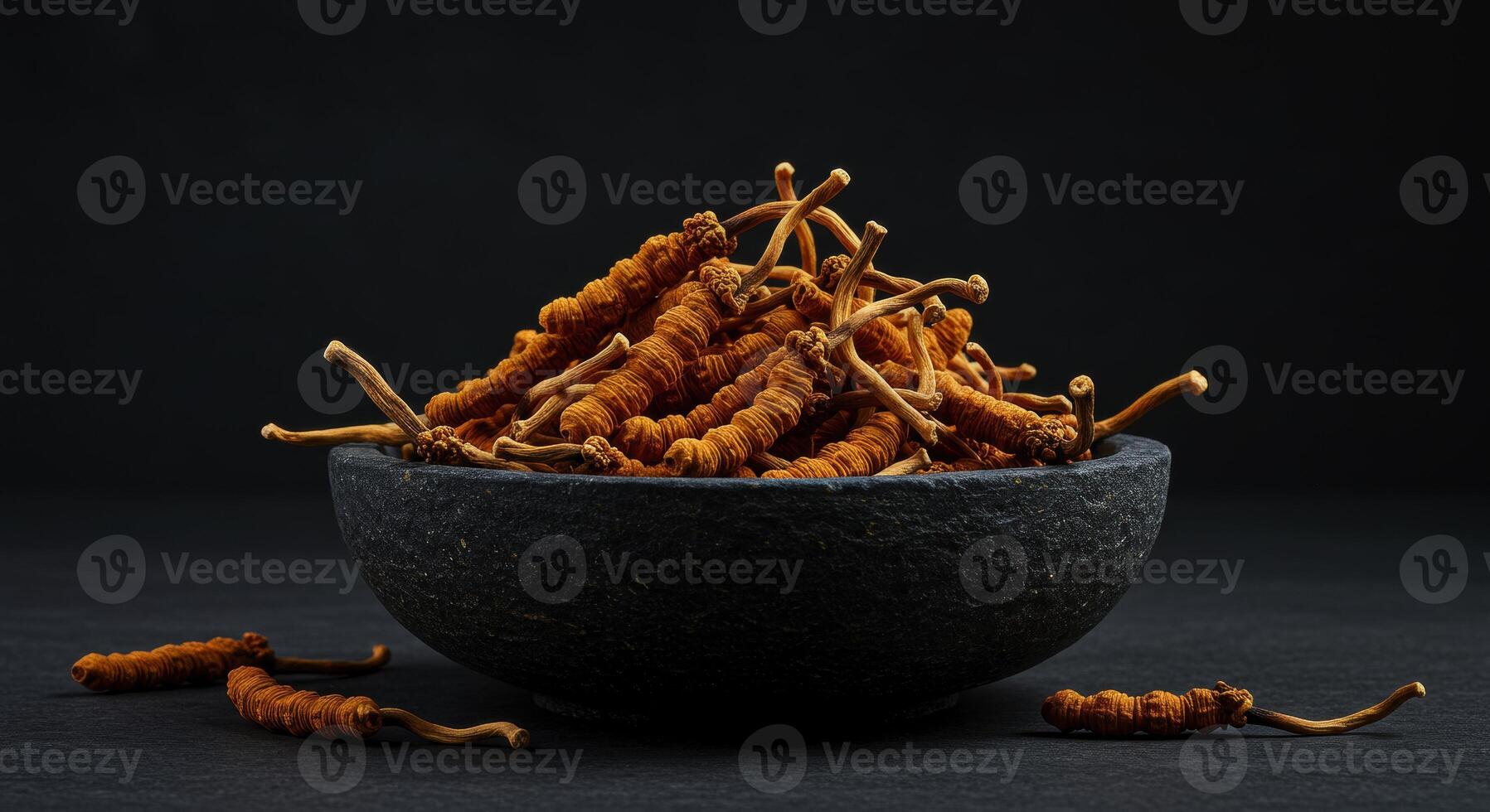Dried Cordyceps Sinensis in Stone Bowl Traditional Chinese Medicine photo