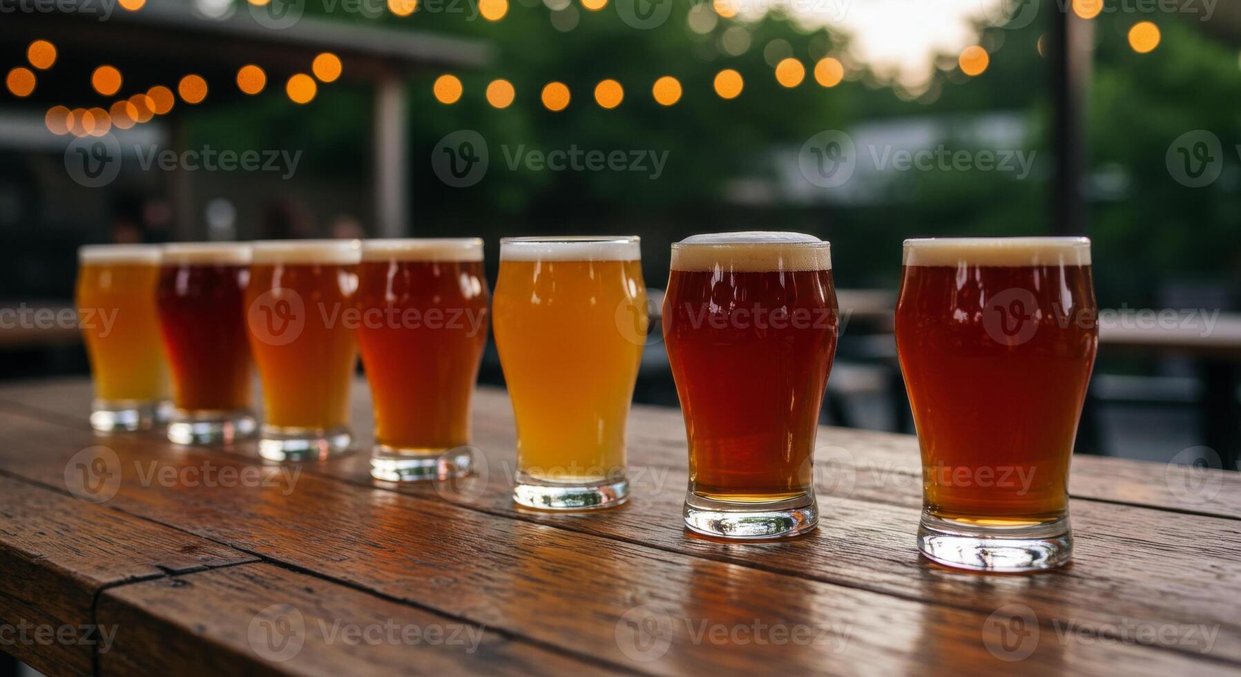 Craft Beer Tasting Flight on Rustic Wooden Table at Bar or Brewery photo