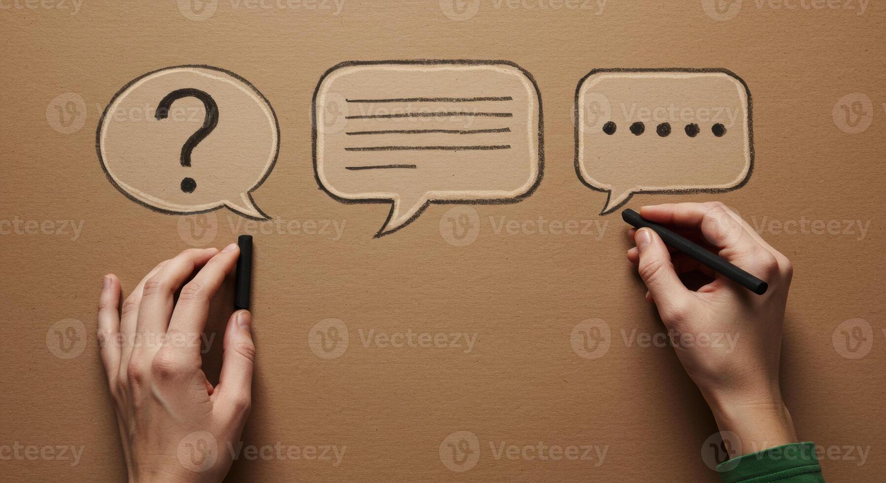 Hands drawing communication symbols speech bubbles question text dots on brown paper photo