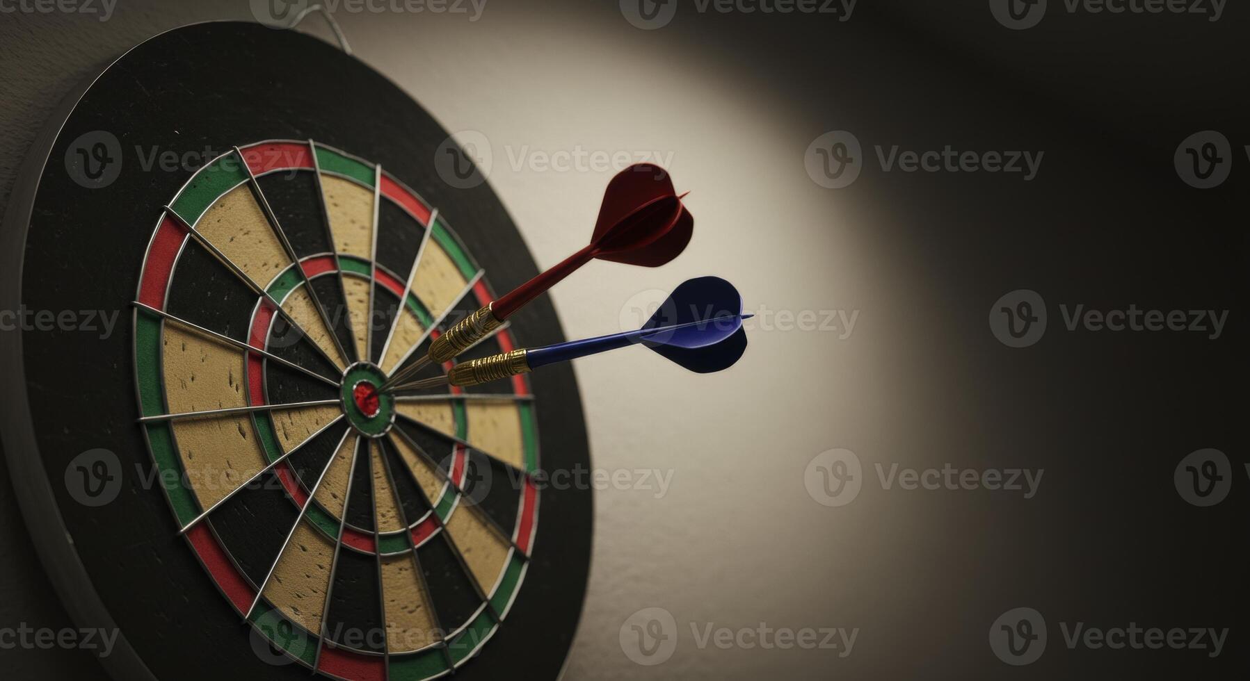 Close up view of a dartboard with two darts stuck near the center target photo