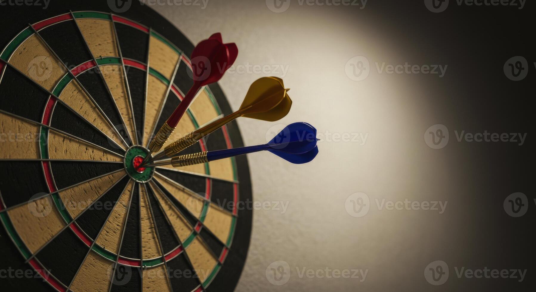 Three darts hit the bullseye of a dartboard representing target and achievement photo